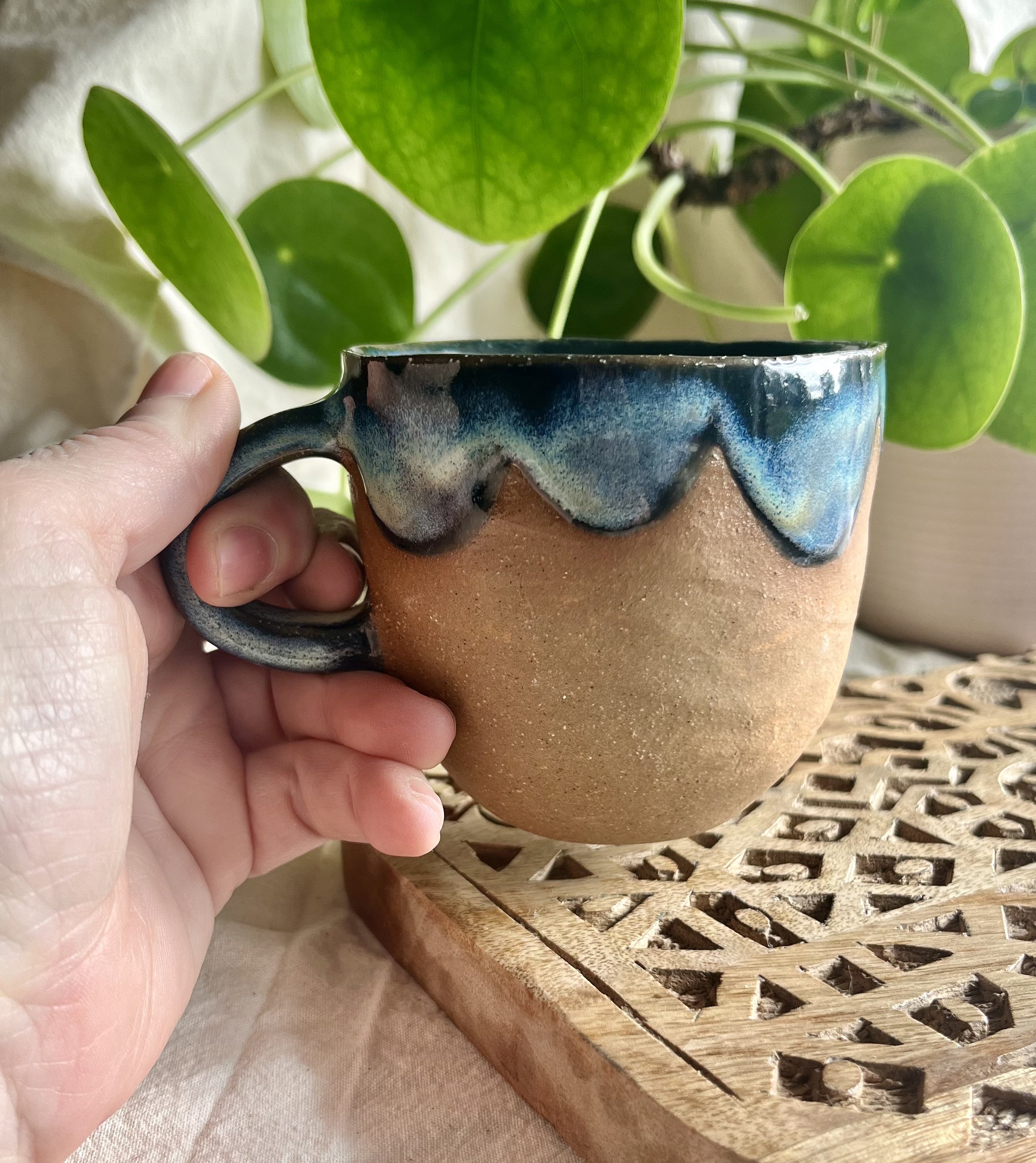 Blue midnight scalloped mug in hand view.jpeg