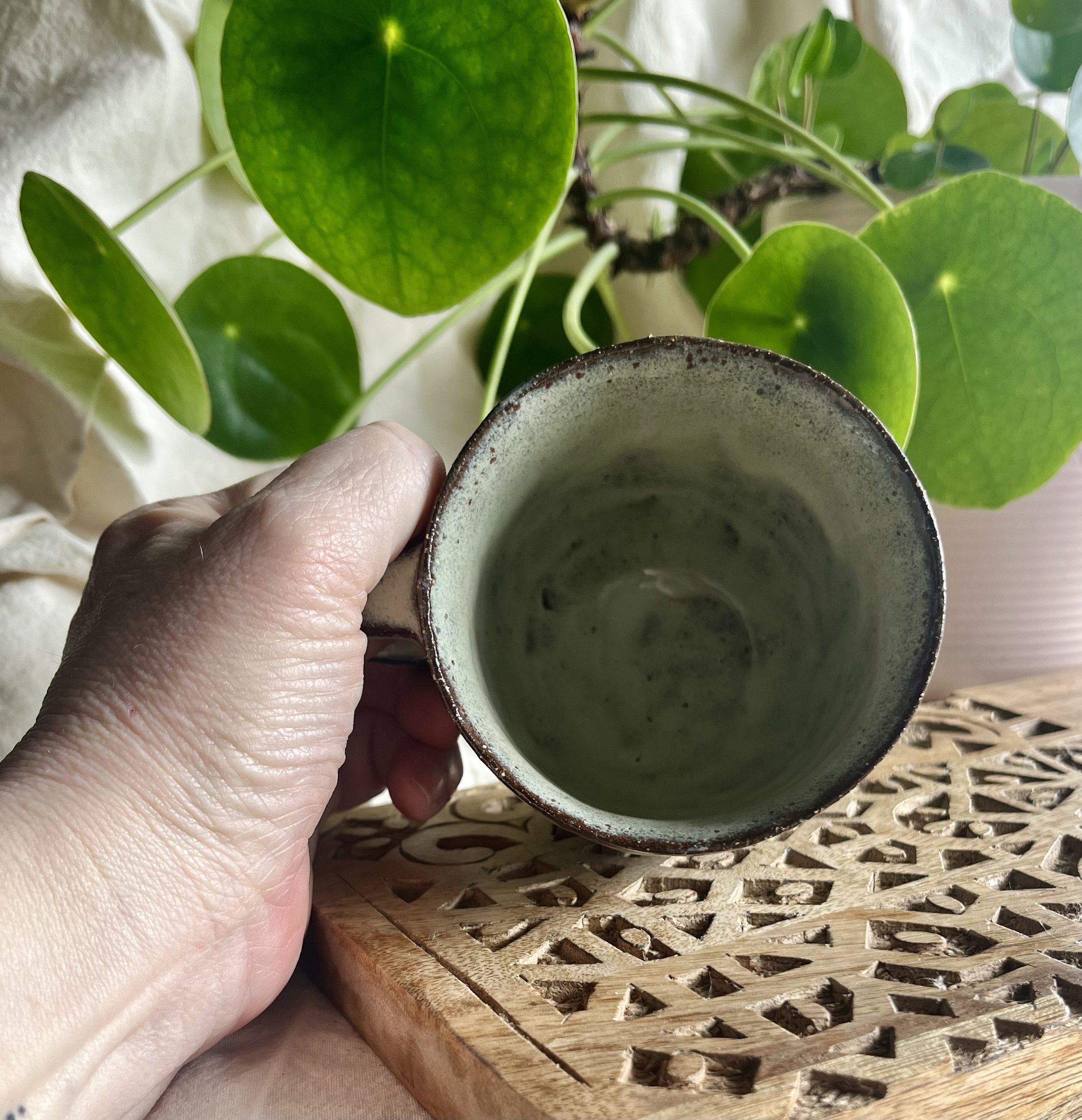 Cream on dark matter scalloped mug 1 inside view.jpeg