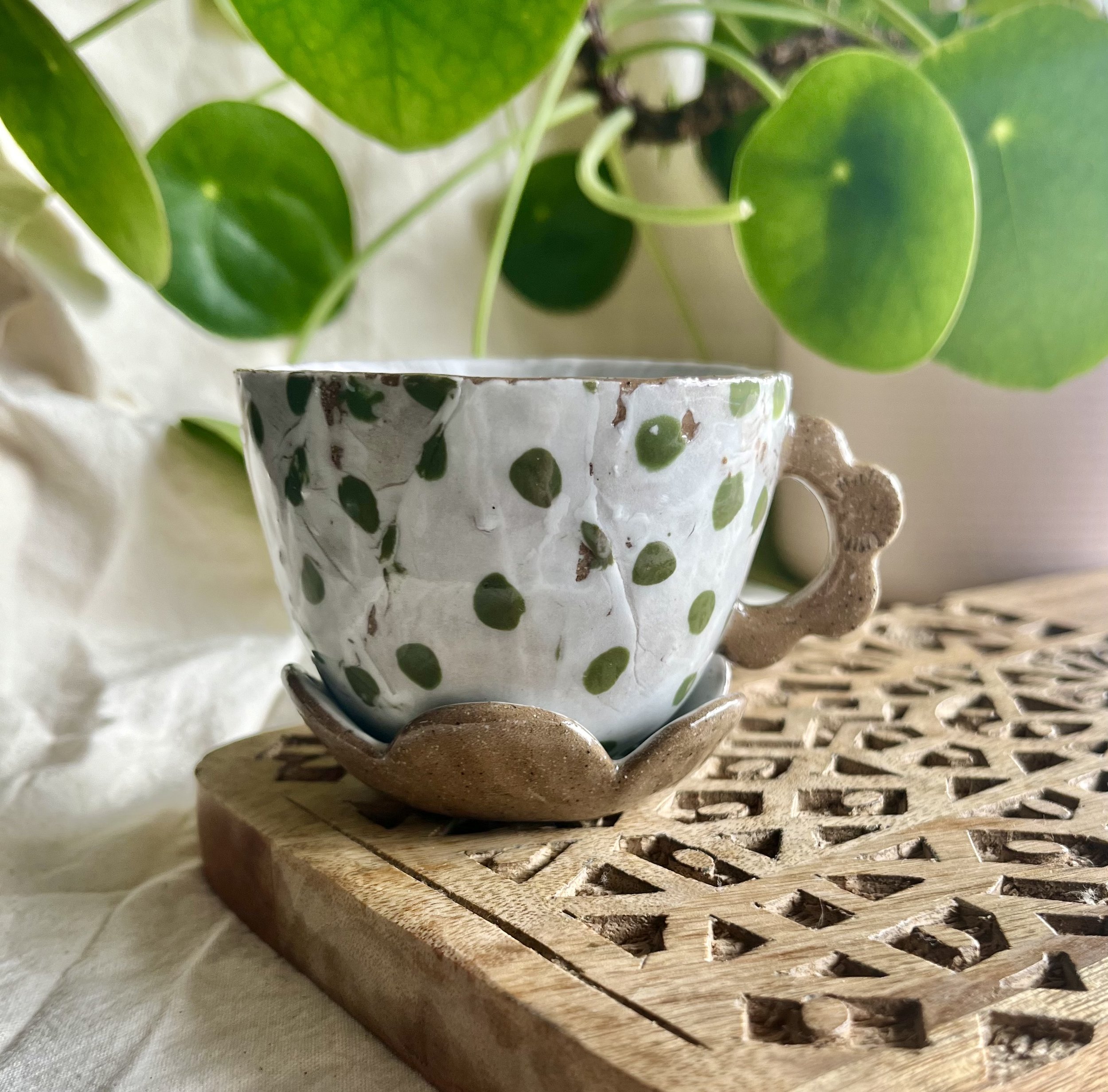 Green spotty espresso cup and saucer front view.jpeg