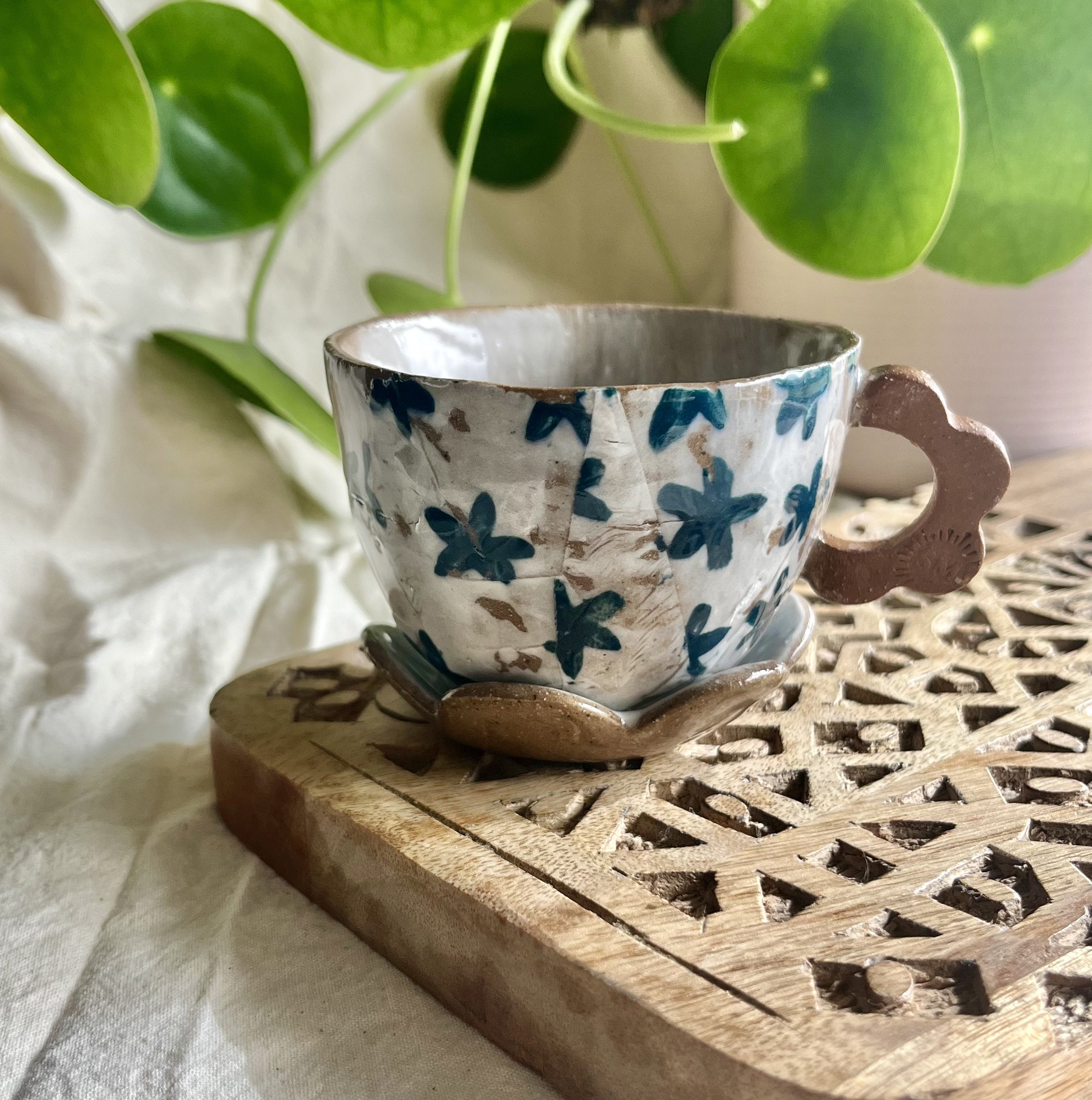 teal flower espresso cup and saucer front view.jpeg