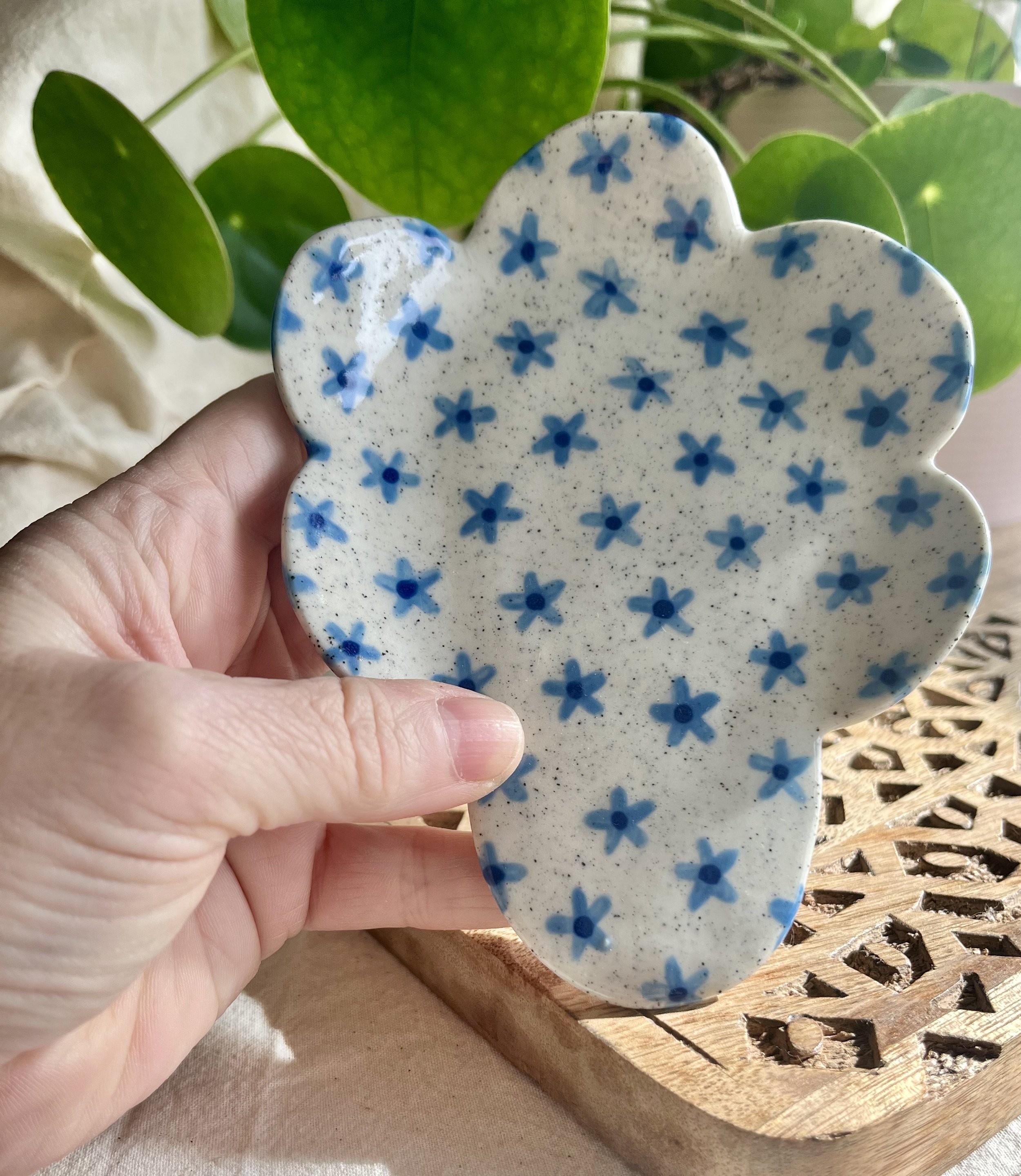 blue flower spoon rest in hand.jpeg