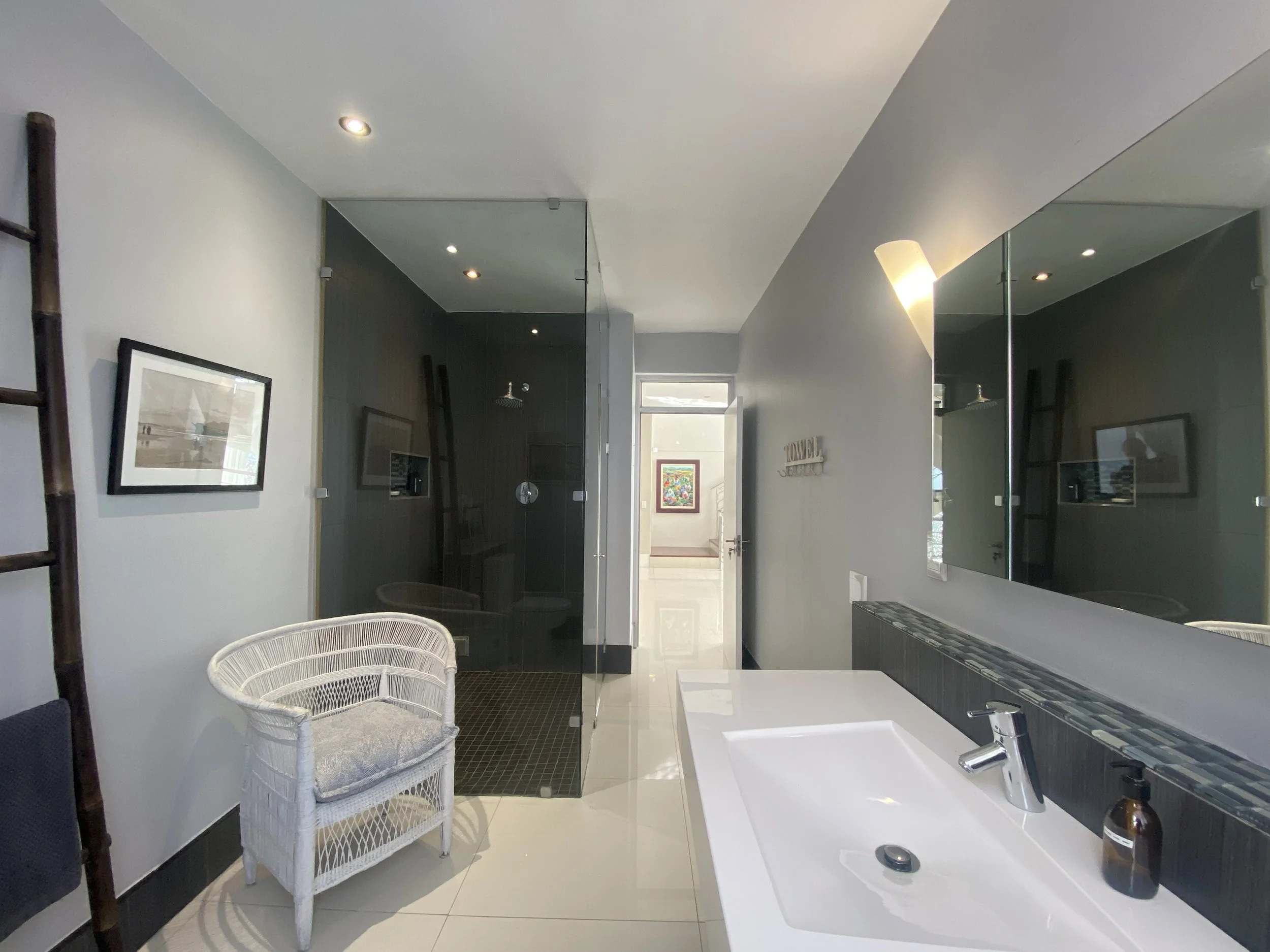 A modern large bathroom with a spacious shower.