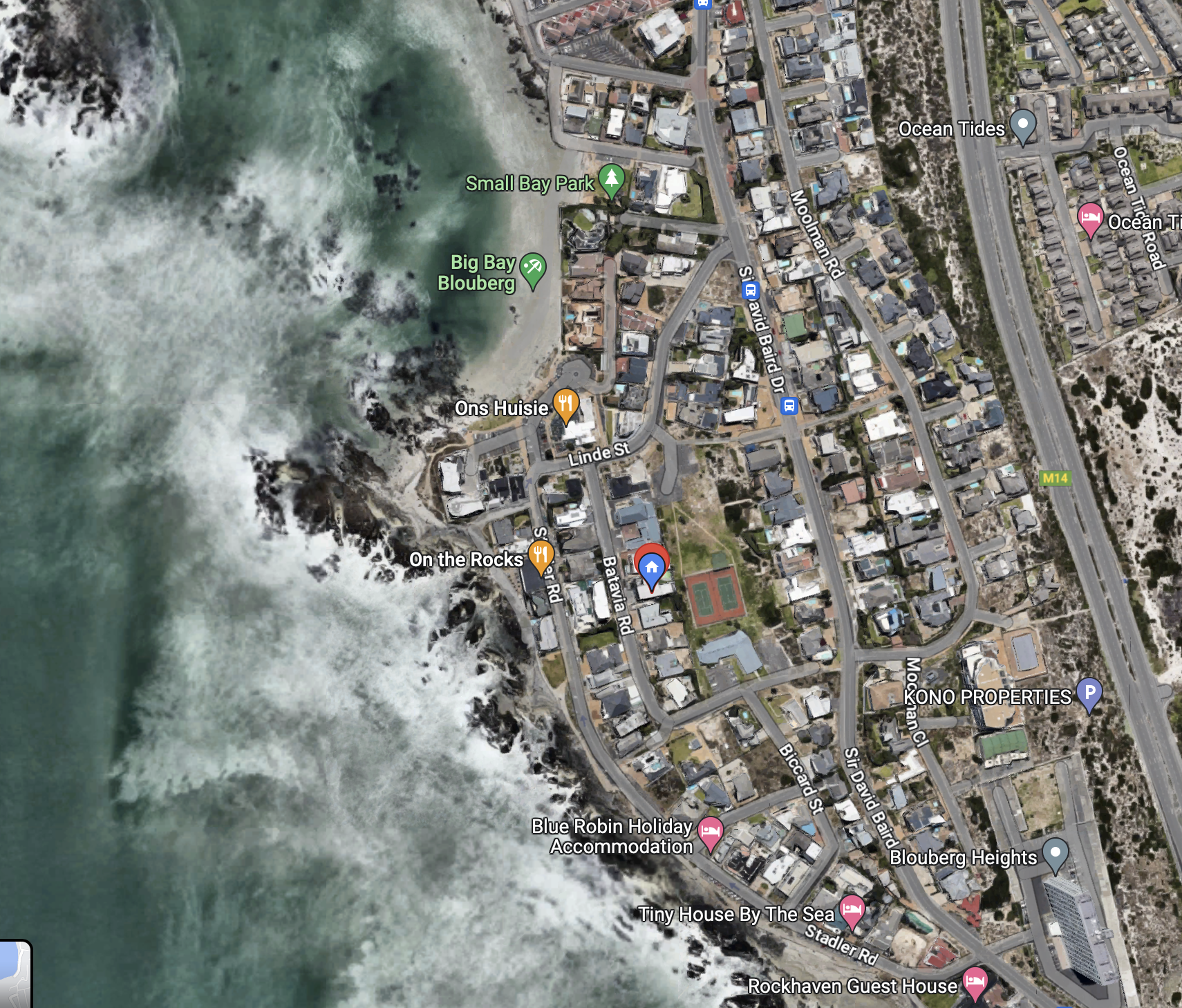 A satellite view of a coastal neighborhood 