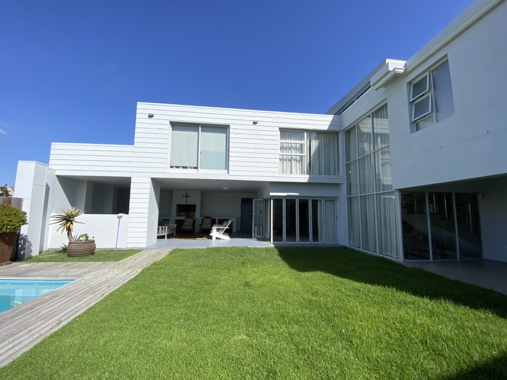 Garden and pool area with covered patio