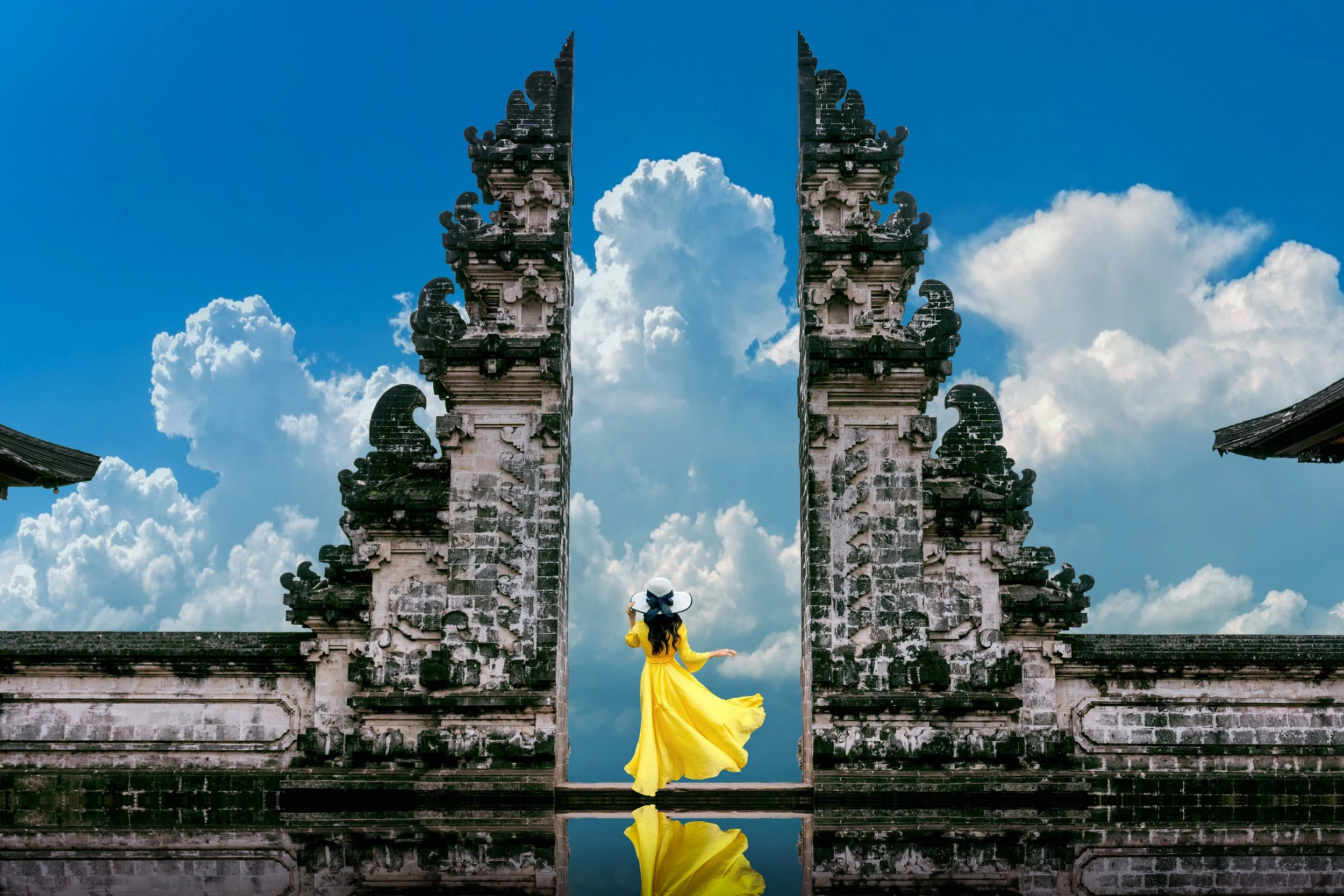 Woman standing at Lempuyang Temple Gates in Bali