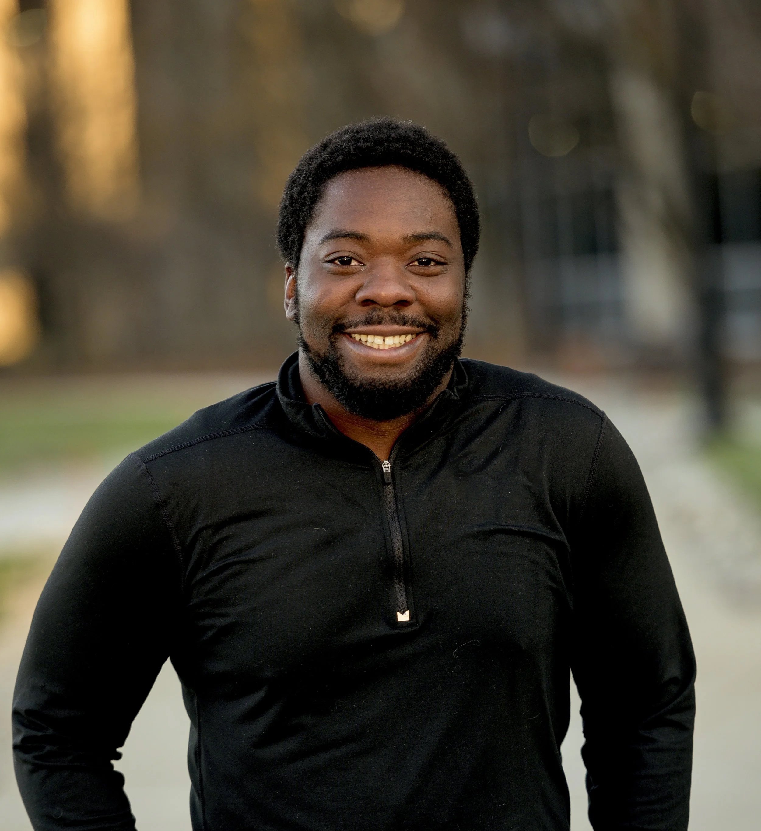 vertical-shot-attractive-african-american-male-smiling-camera.jpg