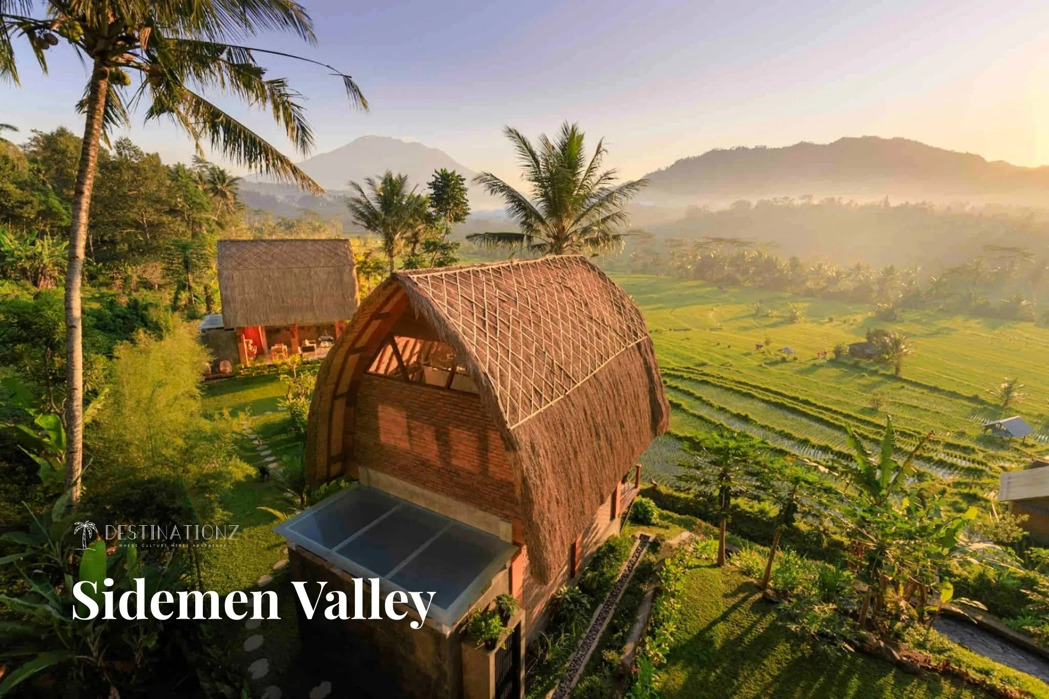 Magical Sidemen Valley landscape with sustainable bamboo villas nestled in green Bali hills.