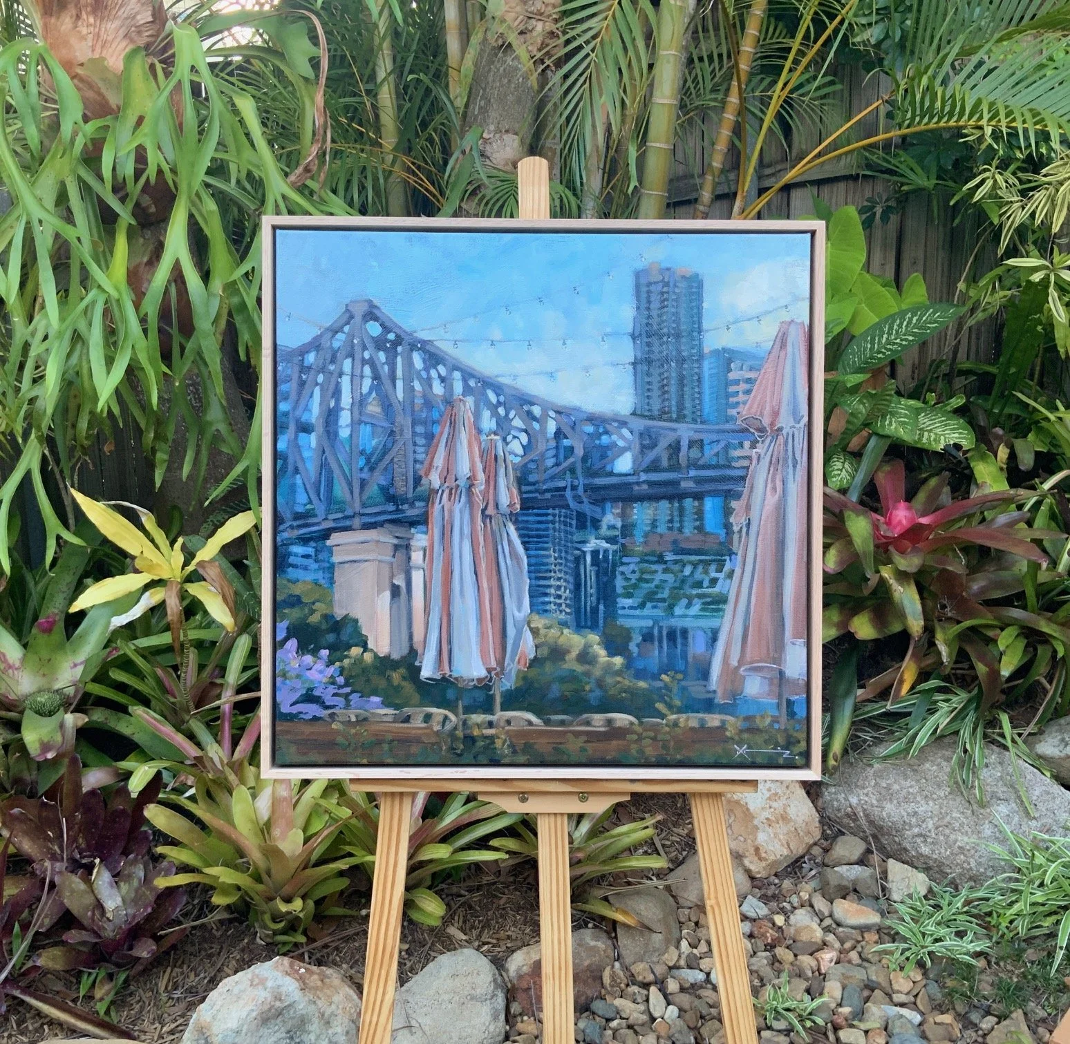 Brollies and the Bridge painting on an easel .jpg