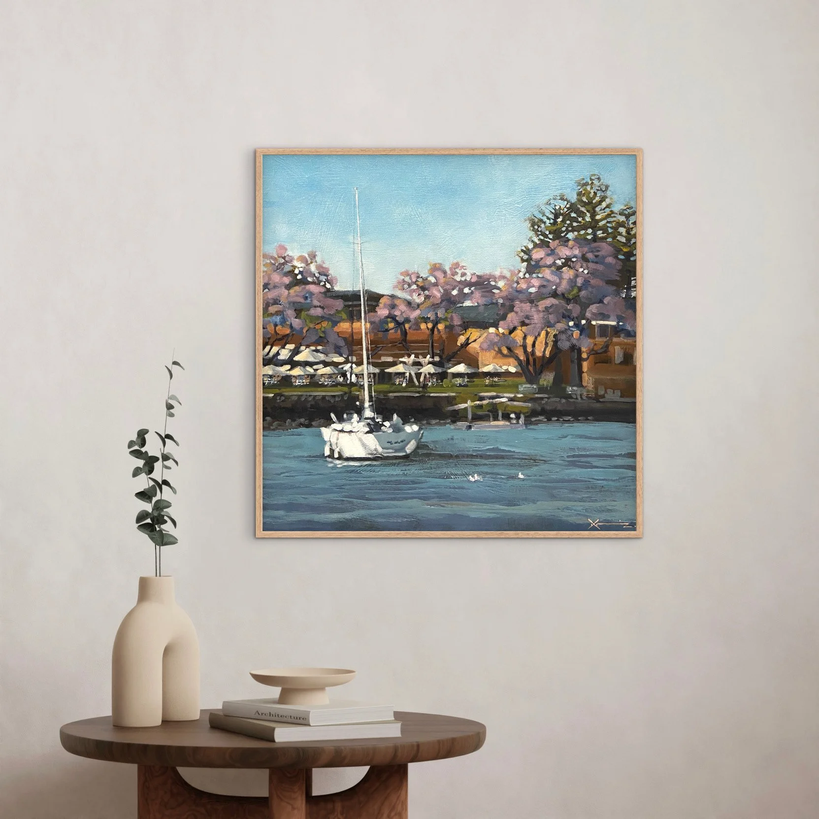 A white yacht in the water in front of Merthyr Bowls Club in New Farm