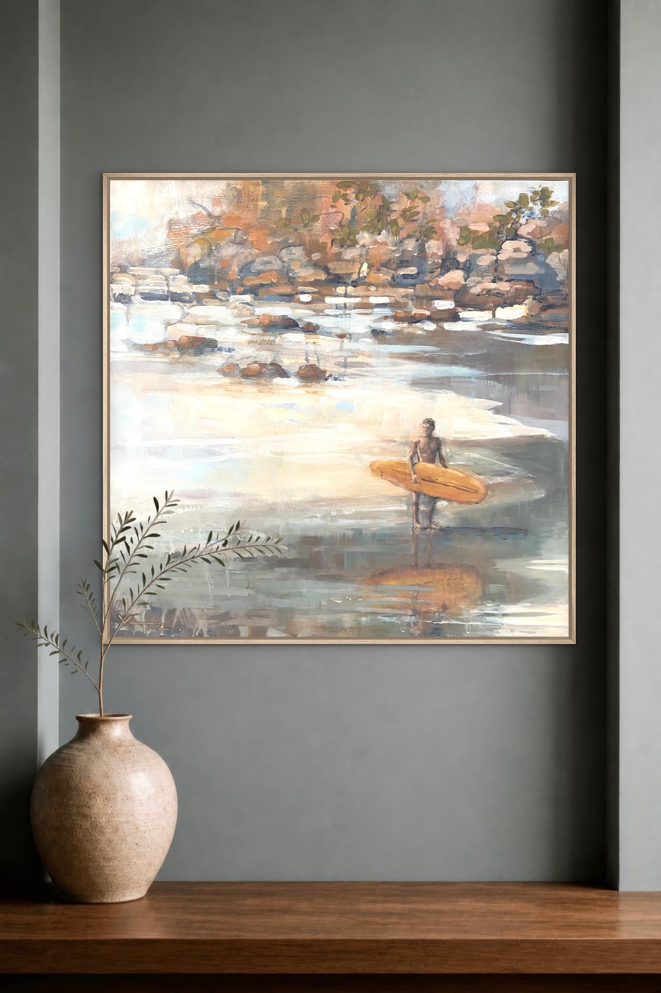 A neutral painting of a surfer in greys and yellows