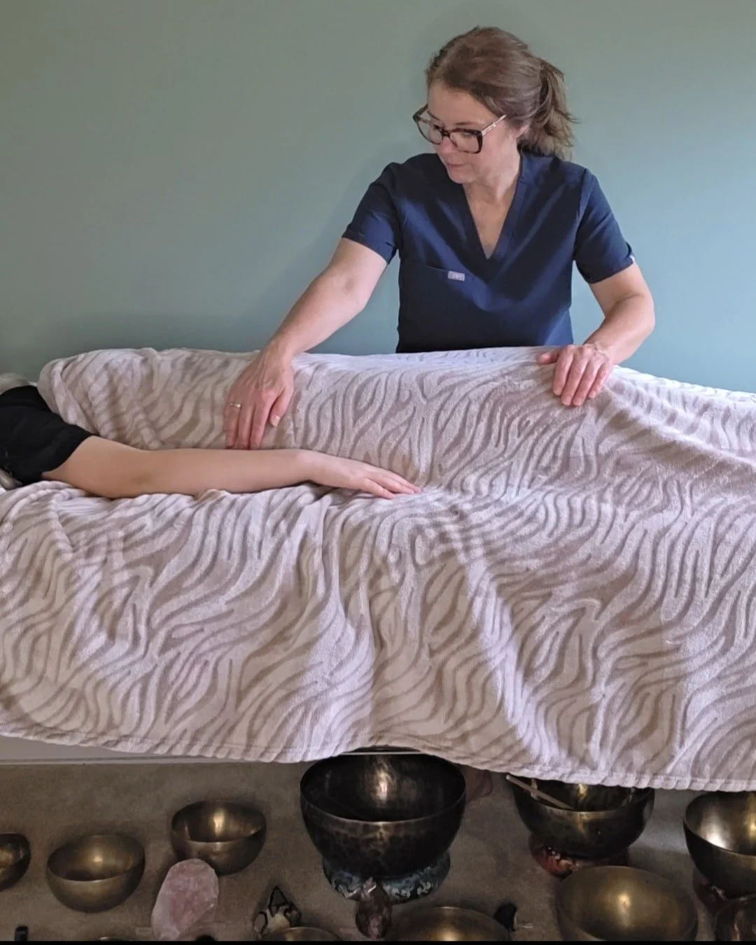 Nichola, a Reiki Master, performing a hands-on holistic healing session for a client in Botley, Southampton.