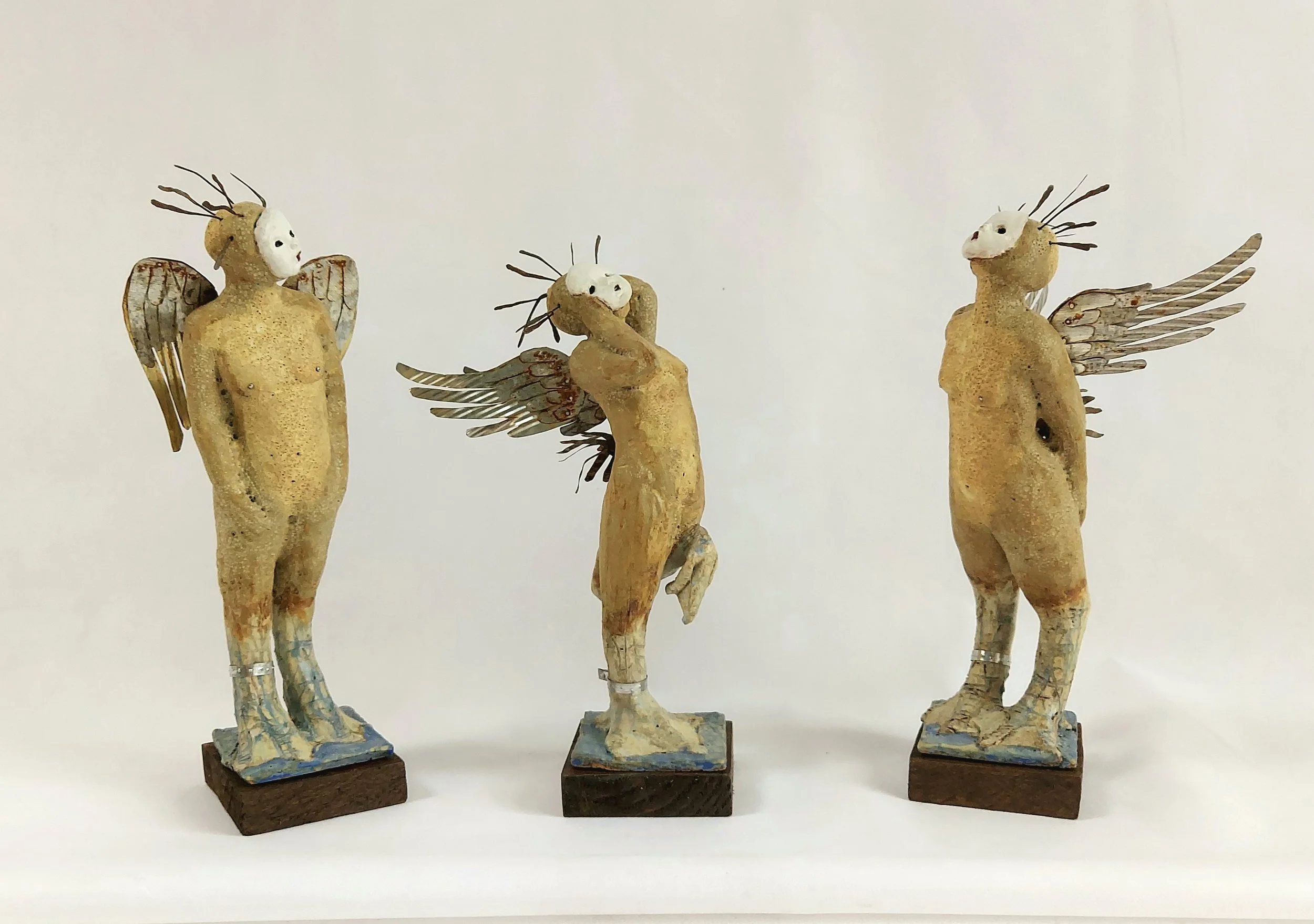 Sirens - 
2021 - 
Three stoneware mythological figures, wings made from tin cans. Part of my solo exhibition 'Myth-understood'
