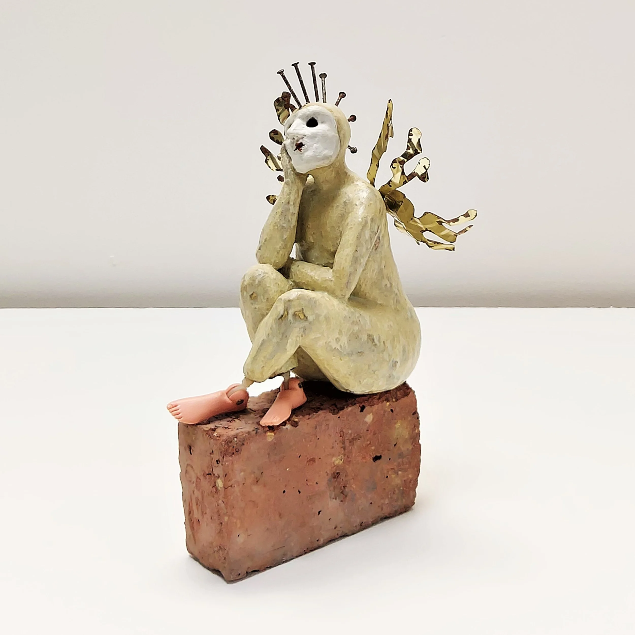 Wallflower Daydreaming - 
2018 - 
Stoneware figure seated on half a red brick with mixed media details