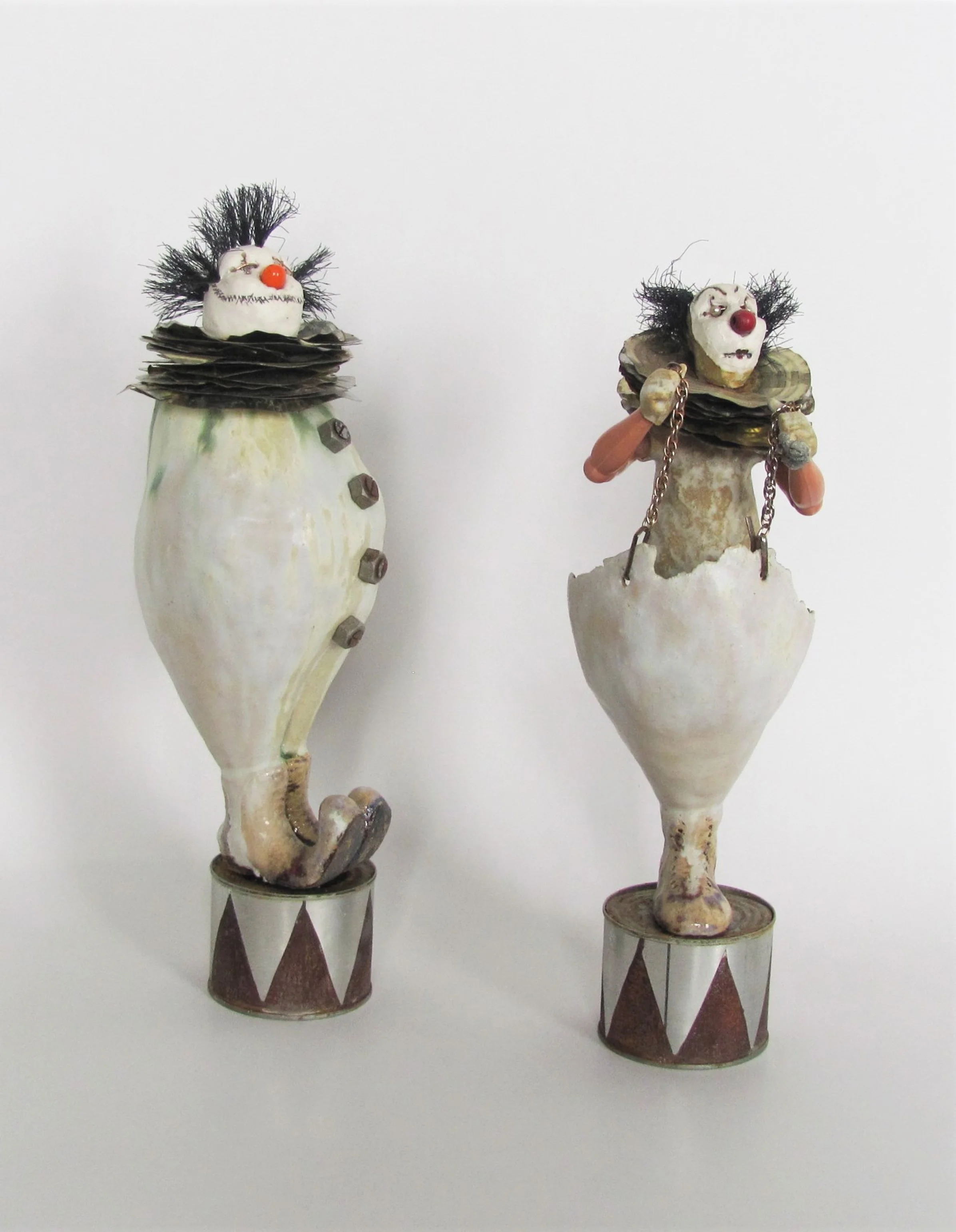 Bump & Grind - 
2018 - 
Stoneware clown figures on altered tin cans, incorporating other materials including doll arms. 
 Click on image for more