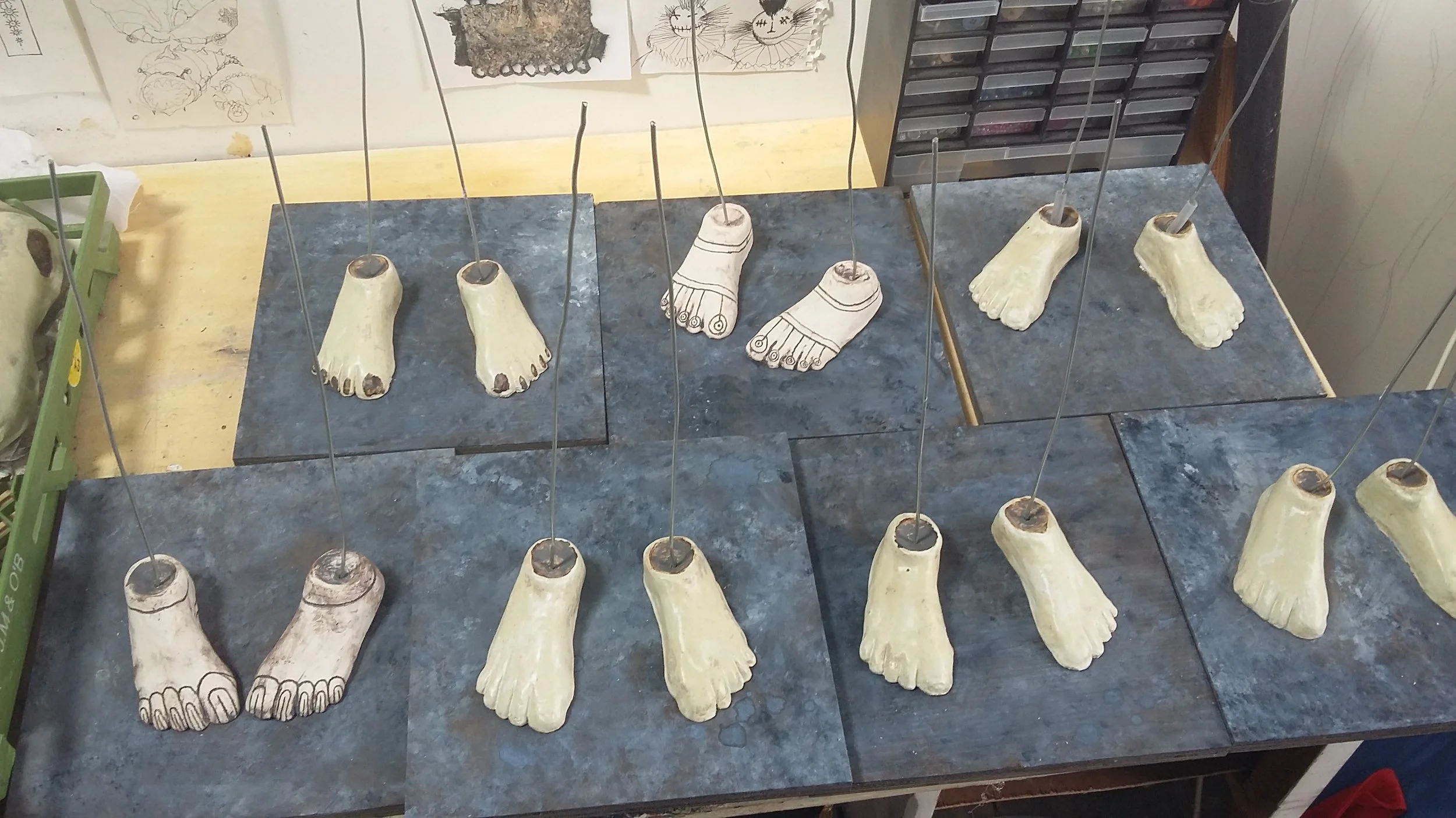 Strings Attached Installation 2017 -      
FEET! - glazed and attached to wooden boards that I attempted to paint close to the colour of the stone floor slabs.