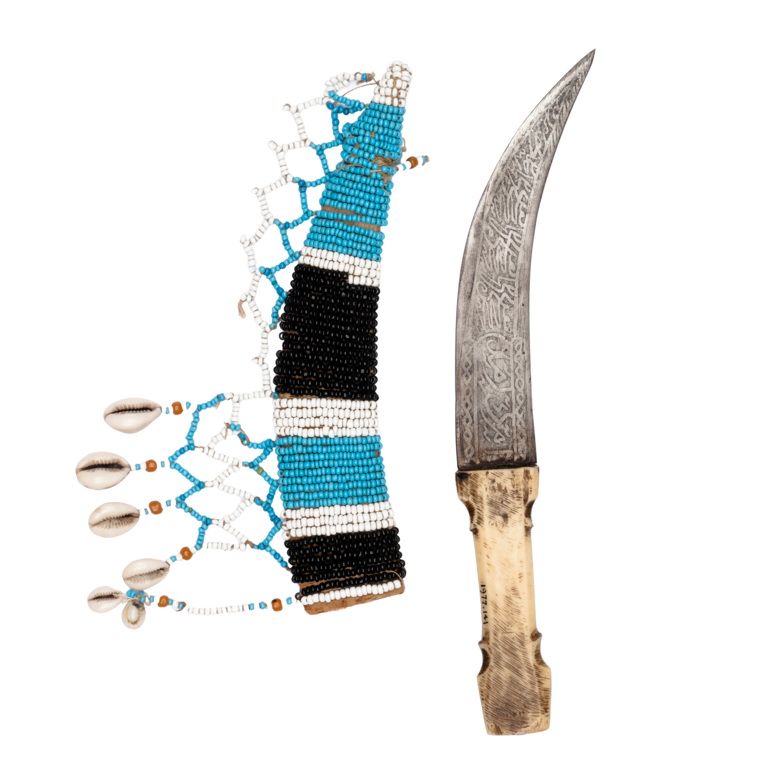 "Dagger with a jambiya pattern. The inscription on the blade is believed to translate as: 'we will obey your rule for ever'.
Use: fighting"