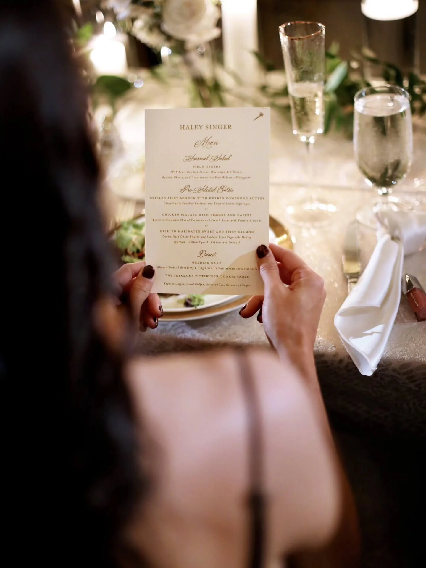There&rsquo;s a moment when everyone finally sits down and the night slows just a little.

You pick this up. Feel the paper, read what&rsquo;s coming, take a sip, look around...and it all starts to land.

The food, the candlelight, the music in the b