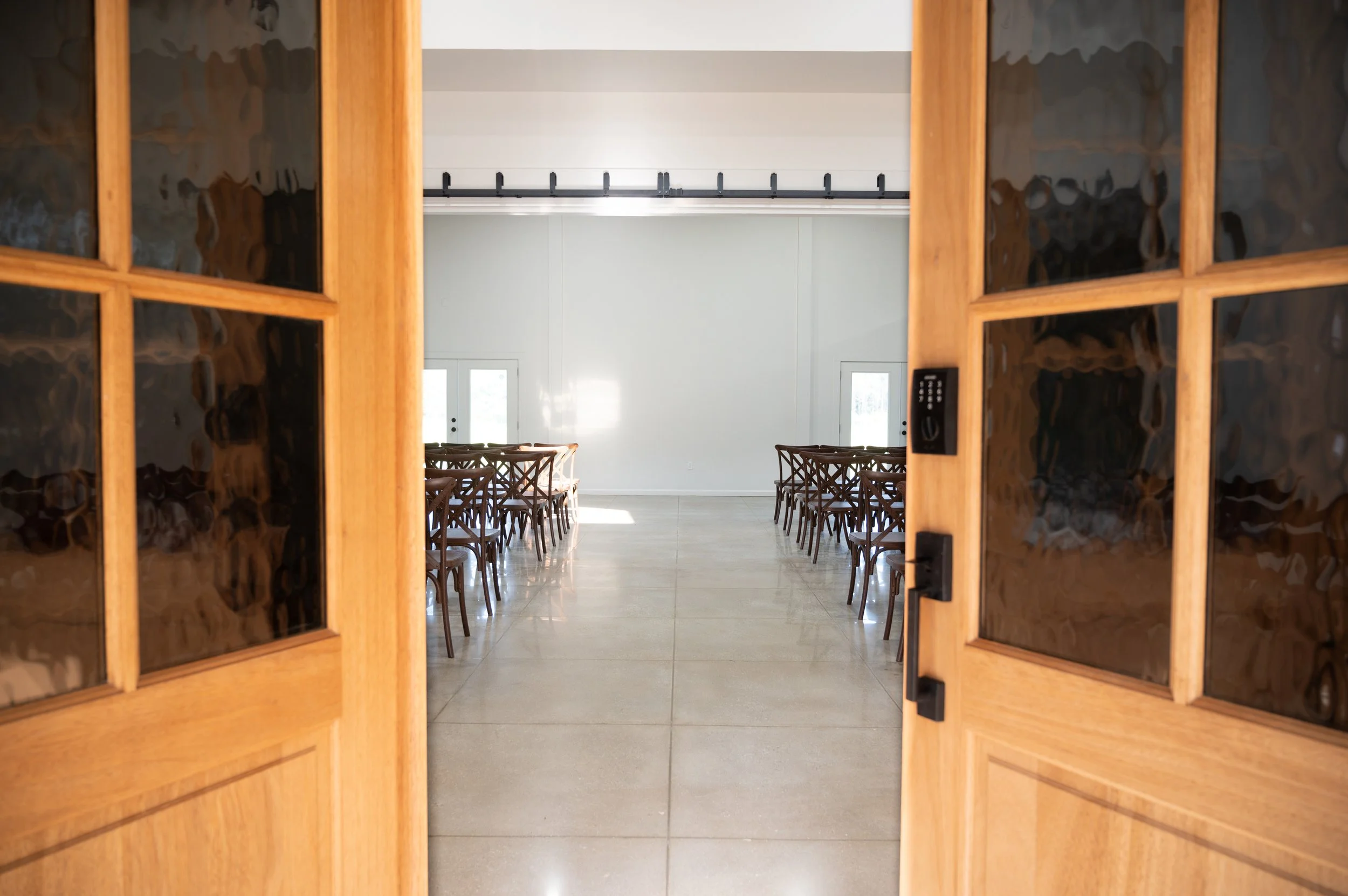 Open doors welcoming guests into Alabama Wedding Venue