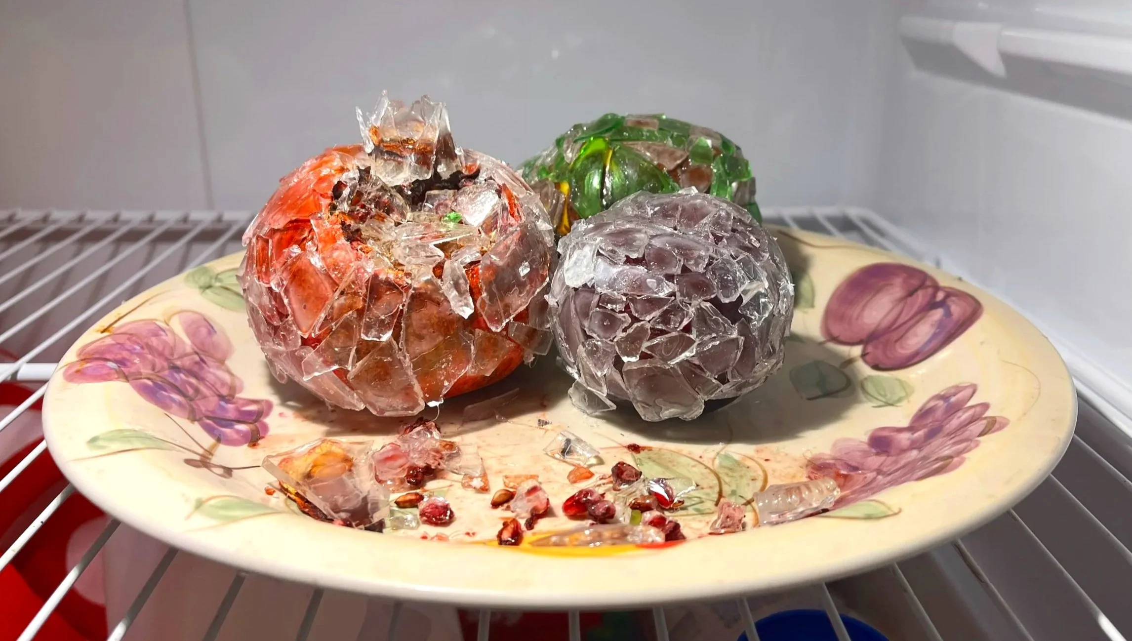 Glass Fruit [front], broken glass, pomegranate, pear, and nectarine, on found plate.