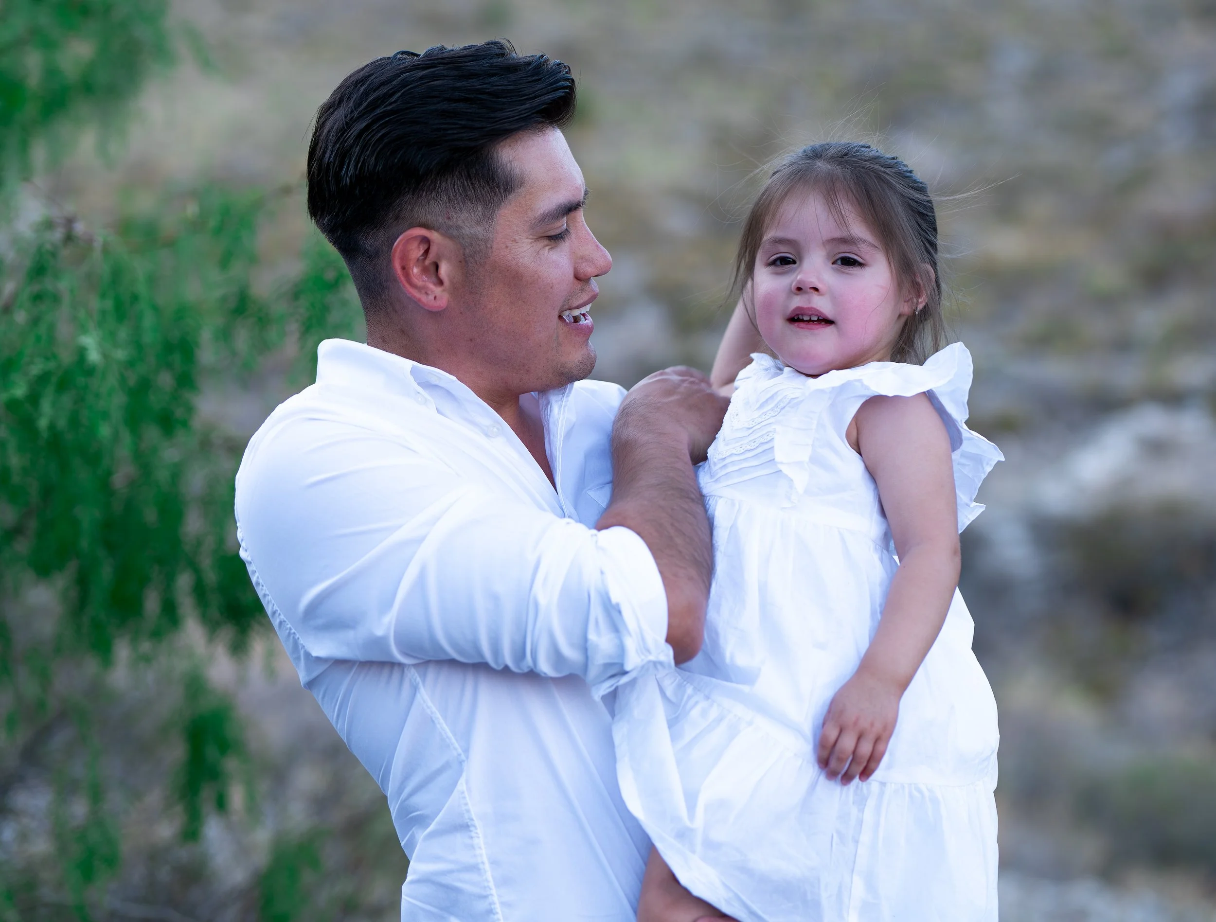 Dad smiling, looking at smiling daughter.jpg
