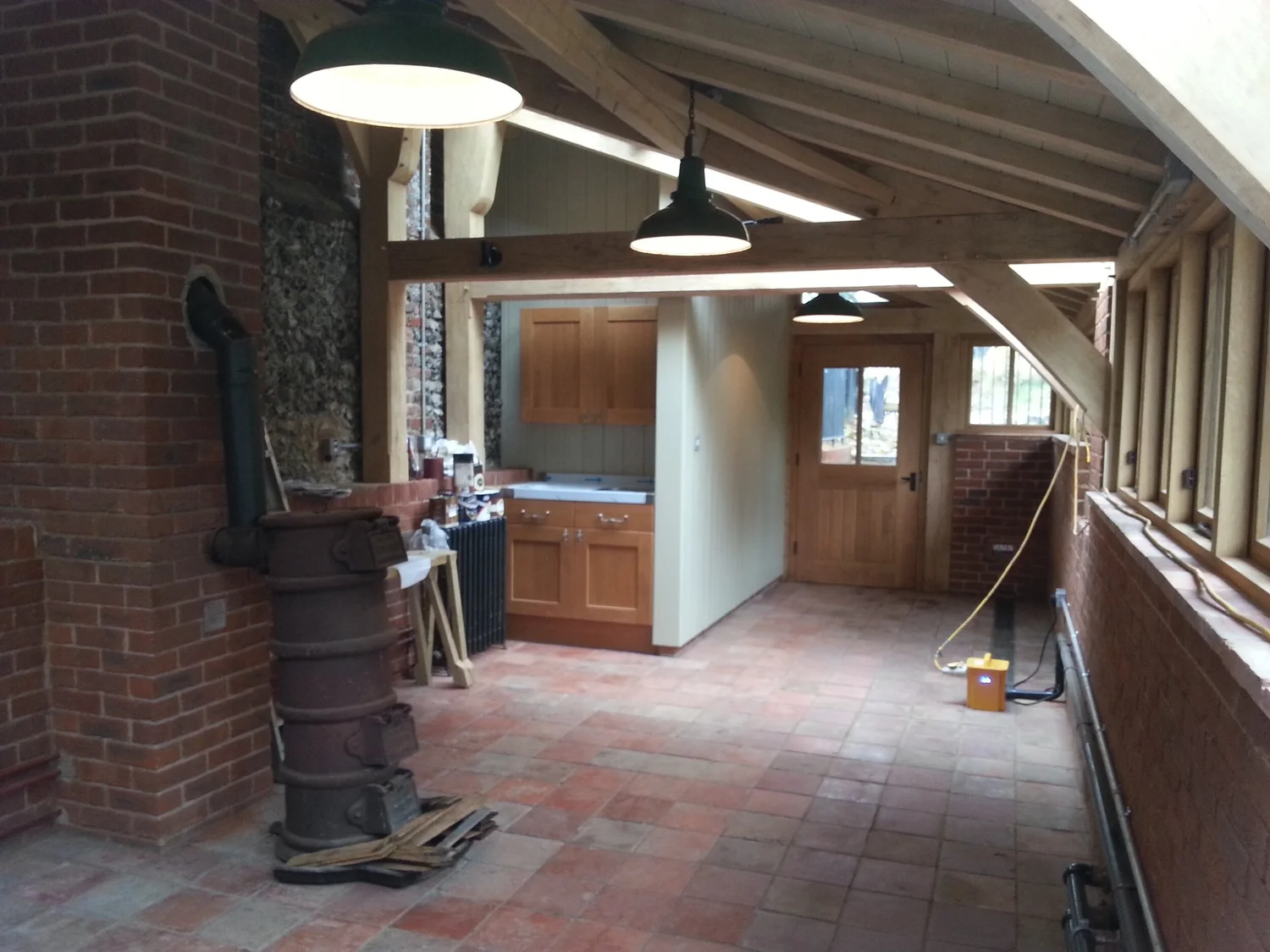Cedar-shingled potting shed with copper trims in Henley-on-Thames