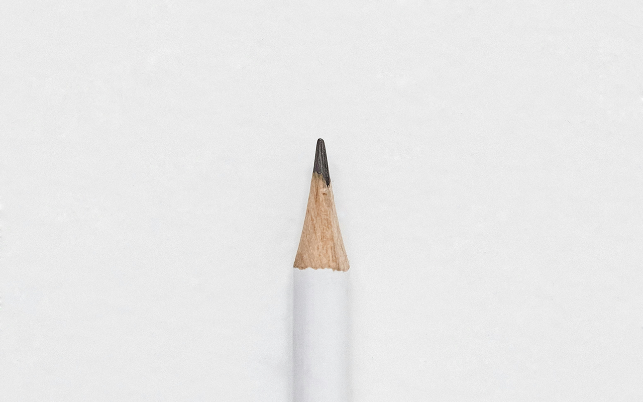 White pencil on white background, representing minimalist thinking