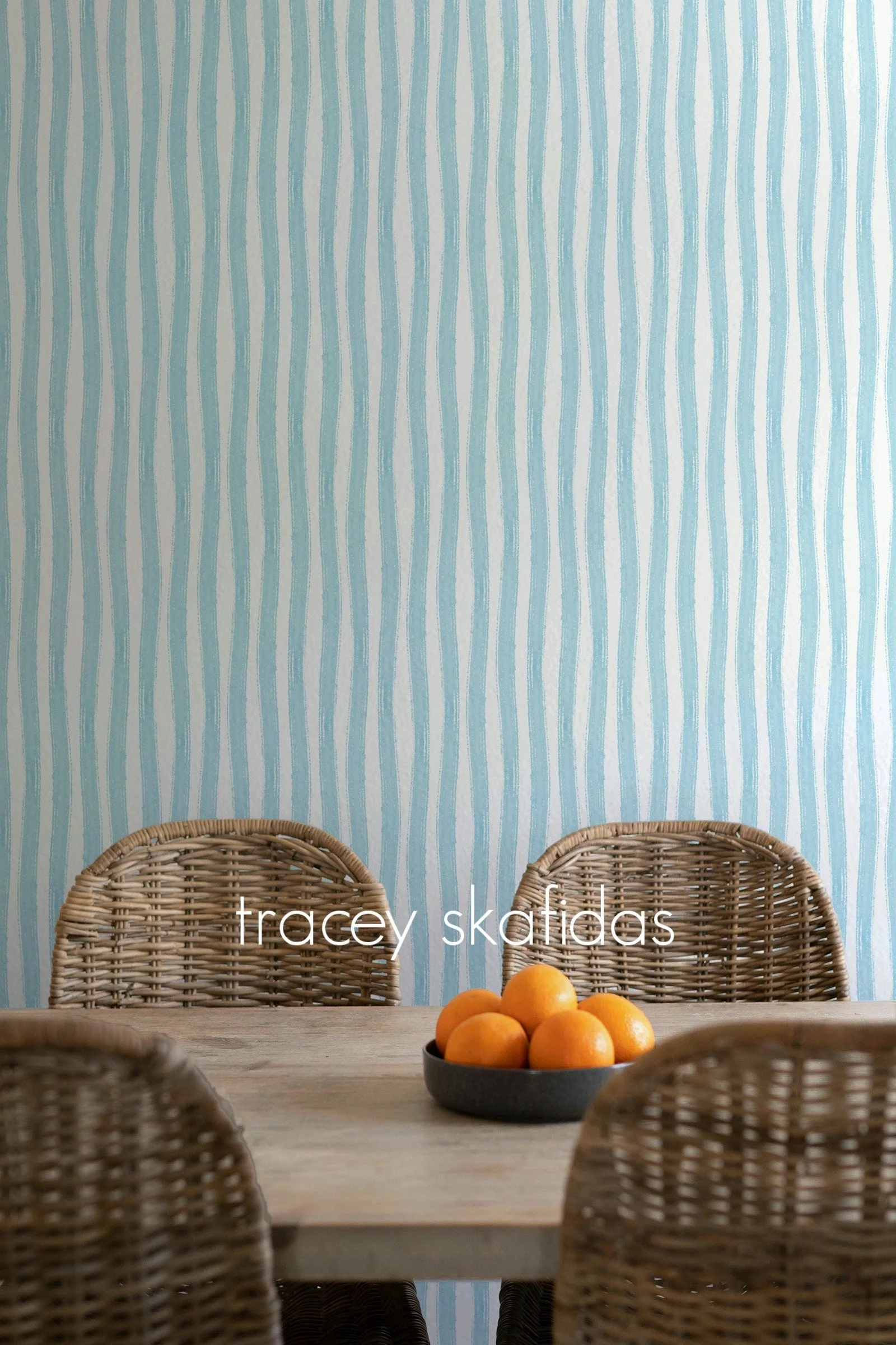 watercolor-washy-stripes-water-blue-dining-room-with-wicker-and-oranges.jpg
