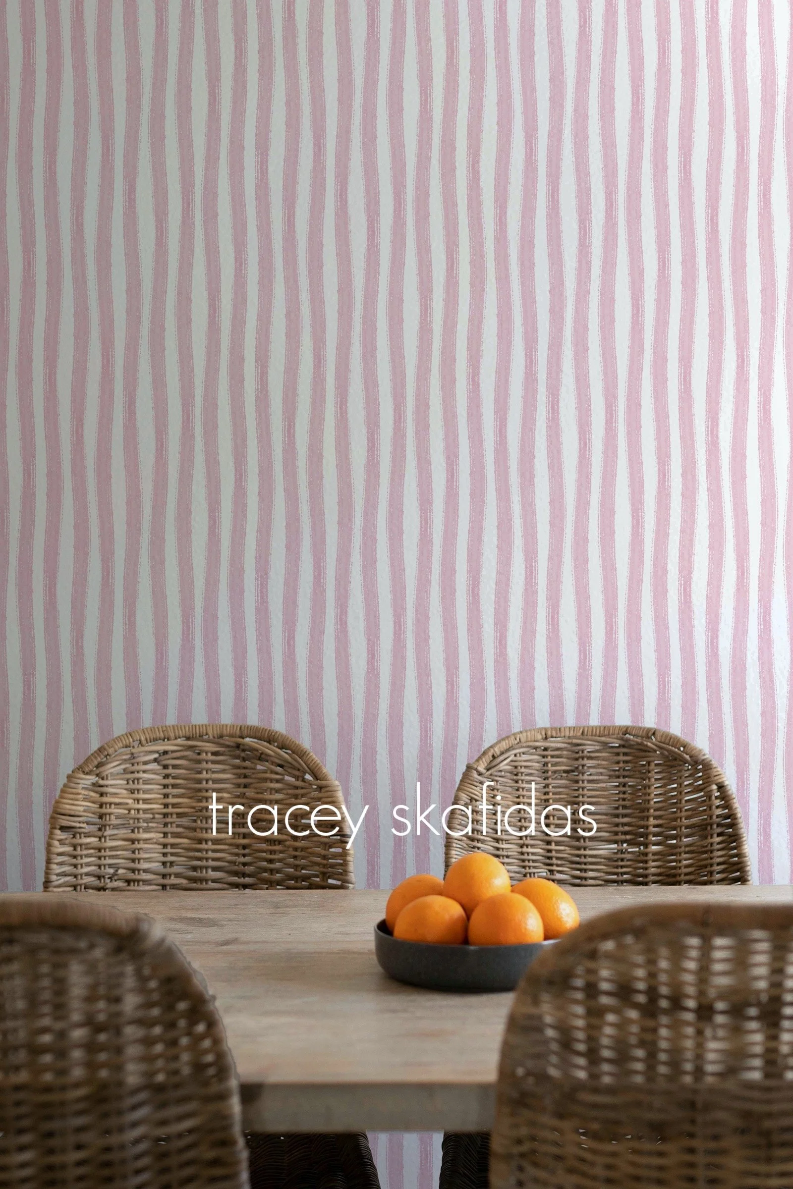 watercolor-washy-stripes-pink-dining-room-with-wicker-and-oranges.jpg