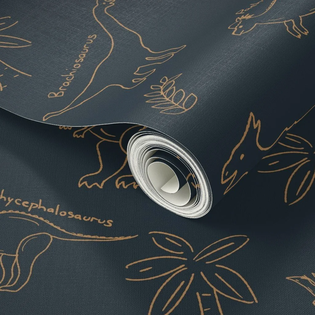 Rolled-up fabric with dinosaur illustrations and the names of dinosaurs, such as Brachiosaurus and Hypsilophodon, printed on it.