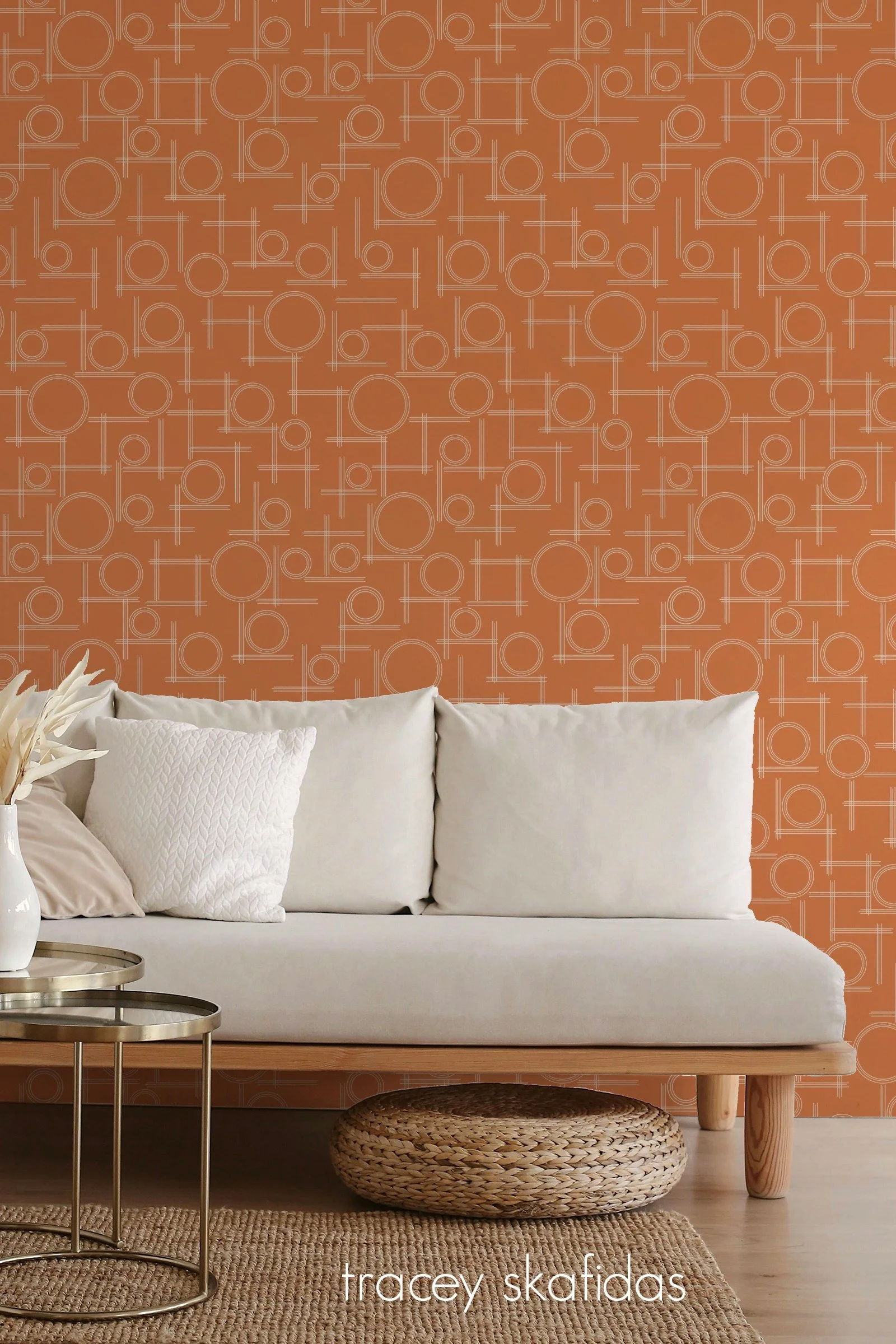 mid-century modern geometric wallpaper in living room with white couch