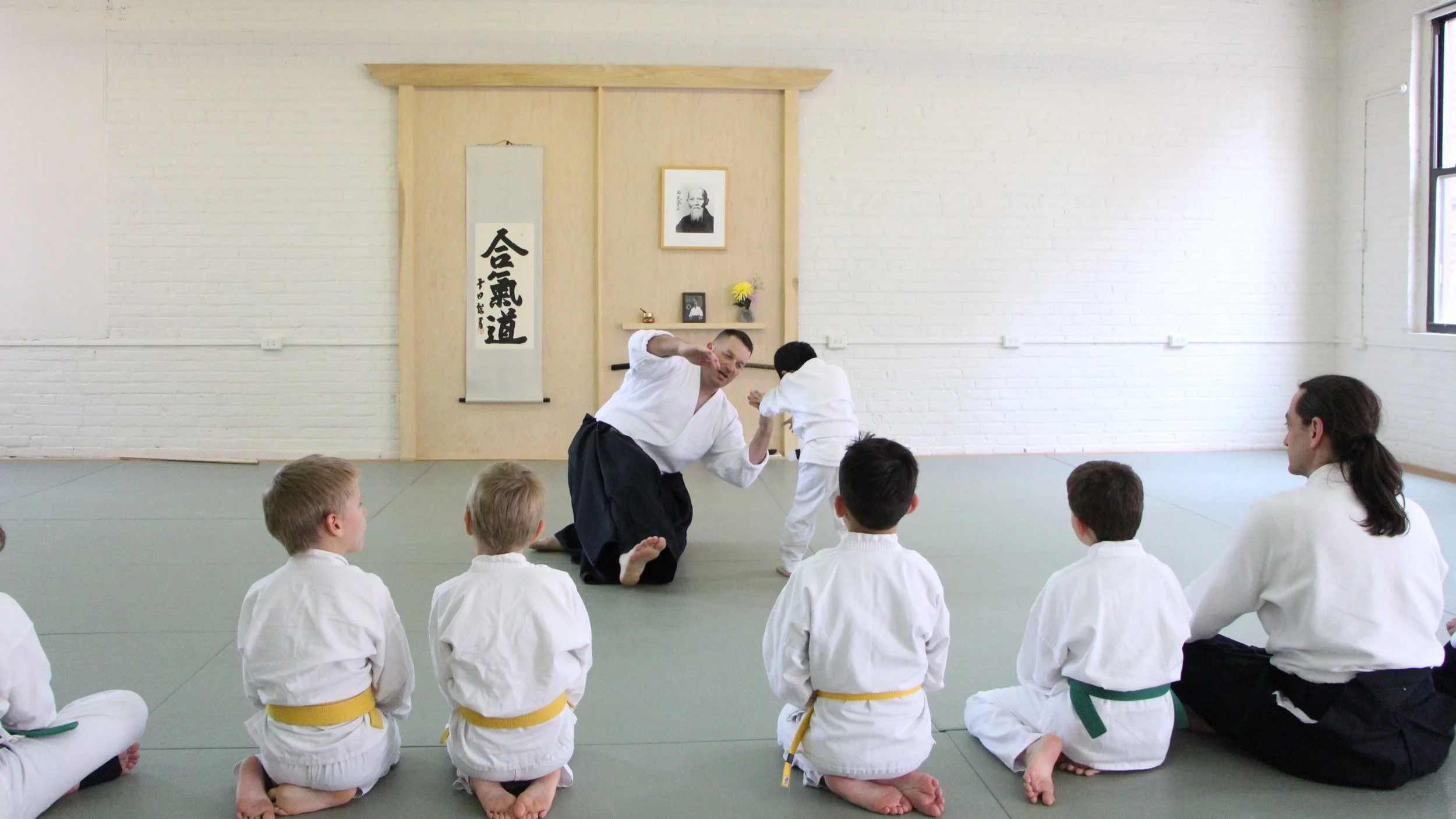 Youth Aikido students receiving instruction together at Alexandria Zen Center