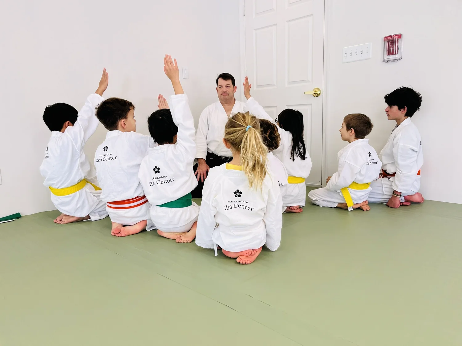 A Youth Aikido instructor engaging students during class at Alexandria Zen Center