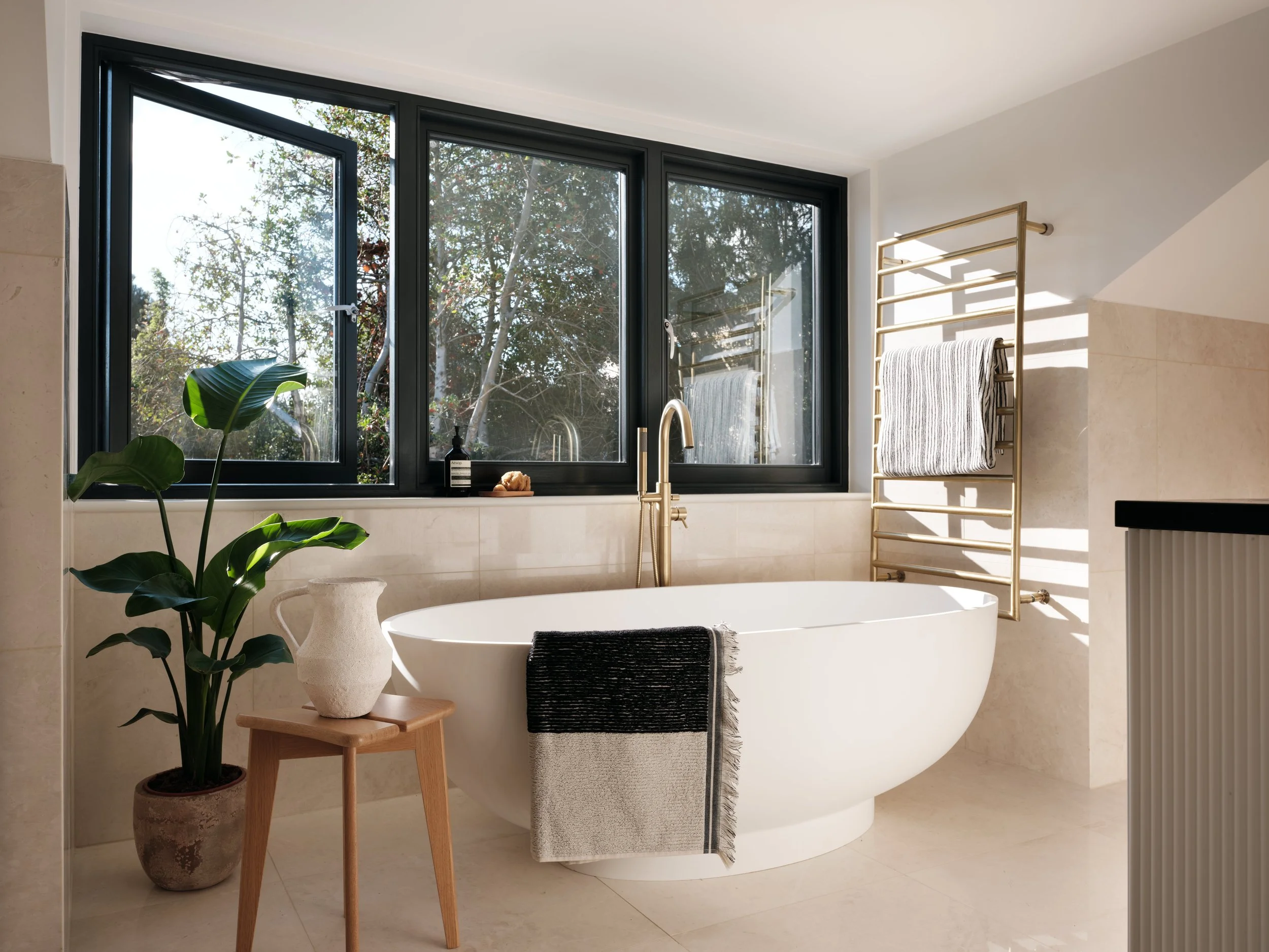 Internal Bedroom 1 Bathroom View to Window and Bath.jpg