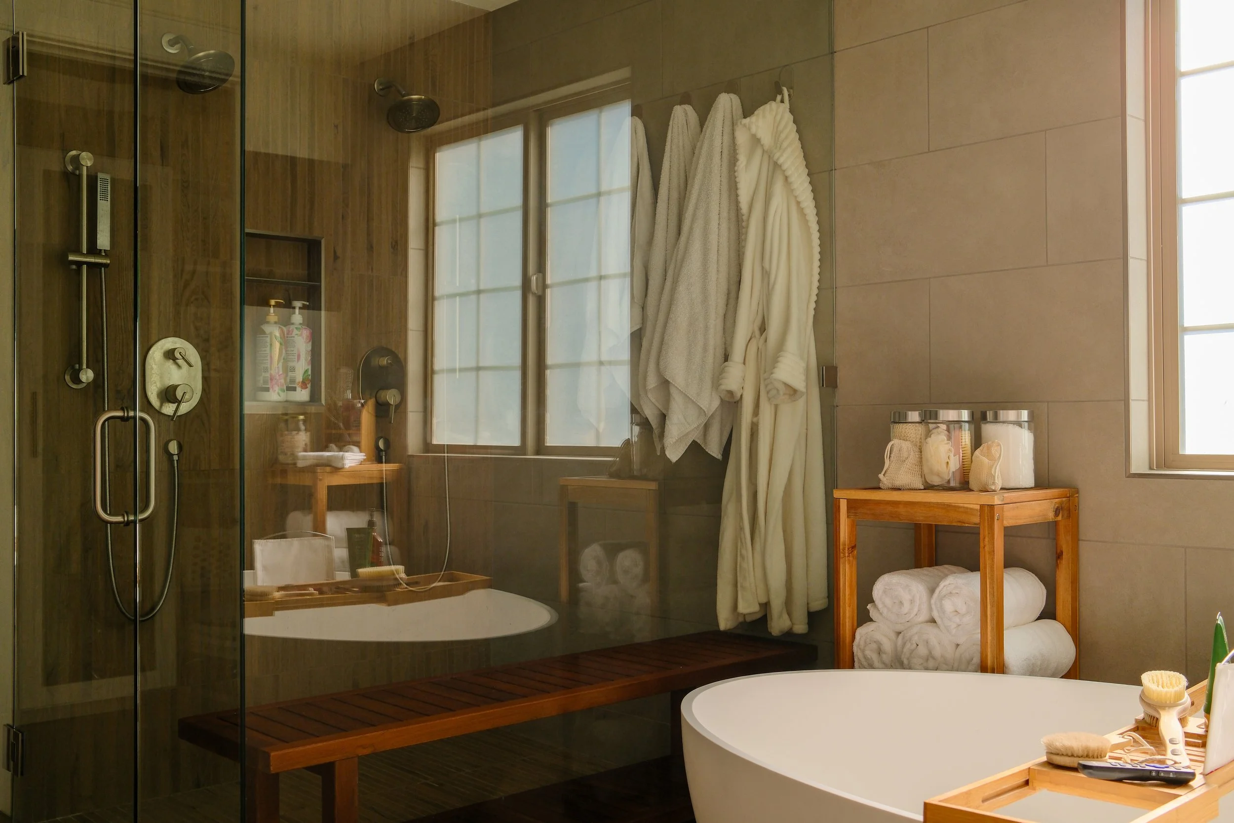 A bathroom dual vanity set with rectangle mirrors and modern cabinetry