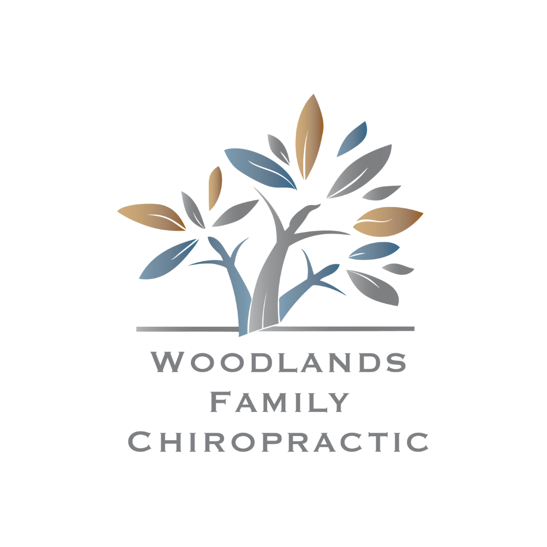 Logo of a tree with multicolored leaves above the text "Woodlands Family Chiropractic".