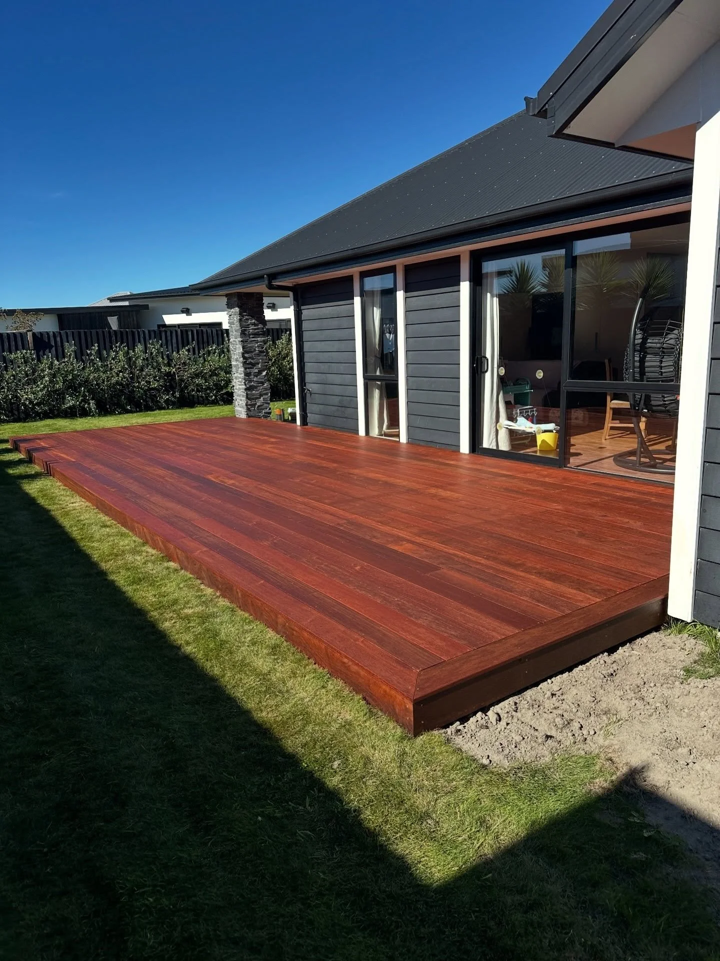 Kwila Deck Built Properly. The ground was slopping down to the existing concrete patio , we used our tight access digger to remove this soil so we could build a level frame. Added in drainage and used all H4 &amp; H5 Treated structural Framing. Follo