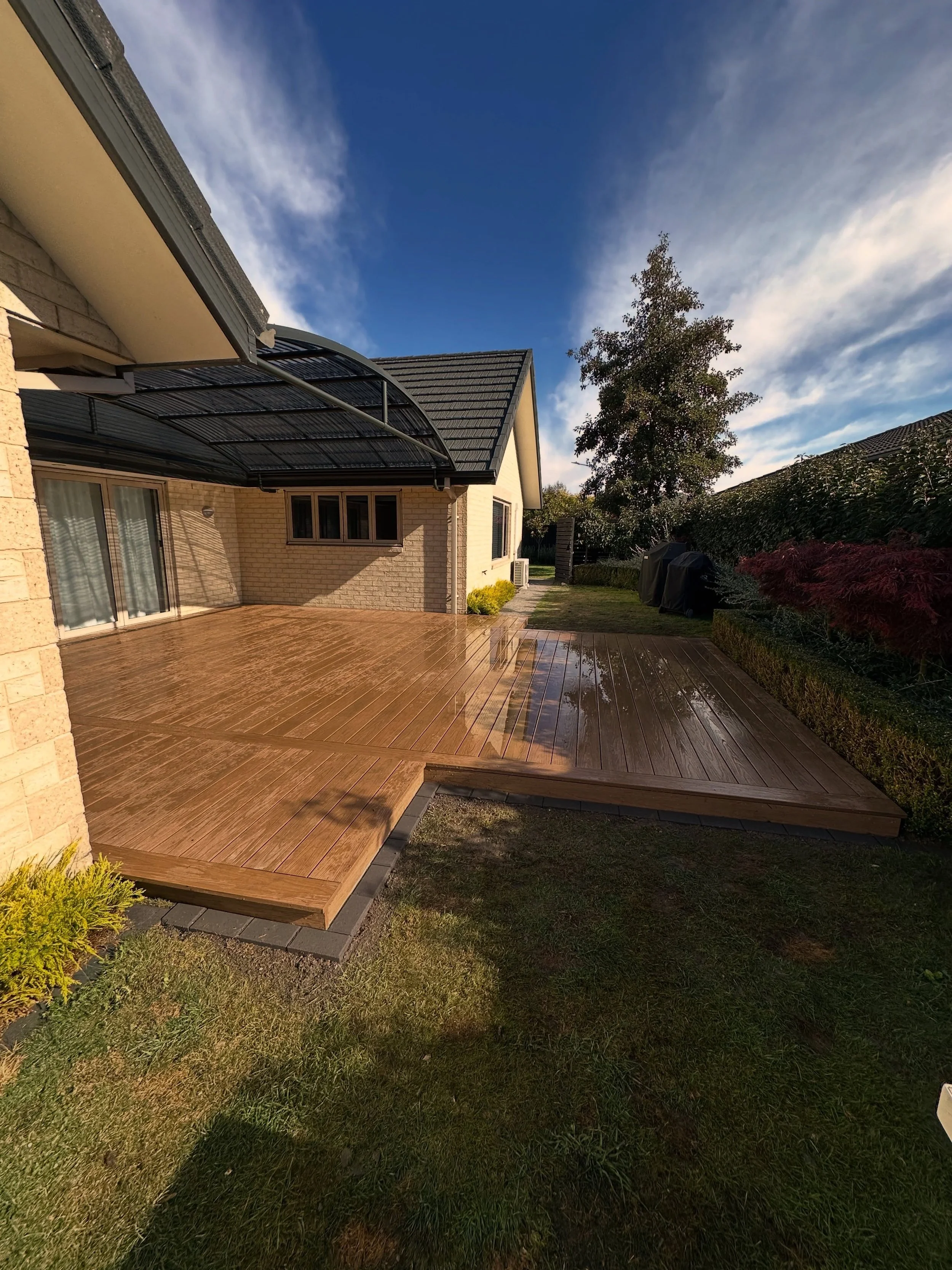 Ekodeck Leatherwood. Basic Plans for the client,Our small access digger to do a site scrape. H4 Treated SG8 framing packed off and fixed to concrete,Joist Tape,Drainage under lawn area, Finished off with Eko Deck on top &amp; with some lawn edging @e