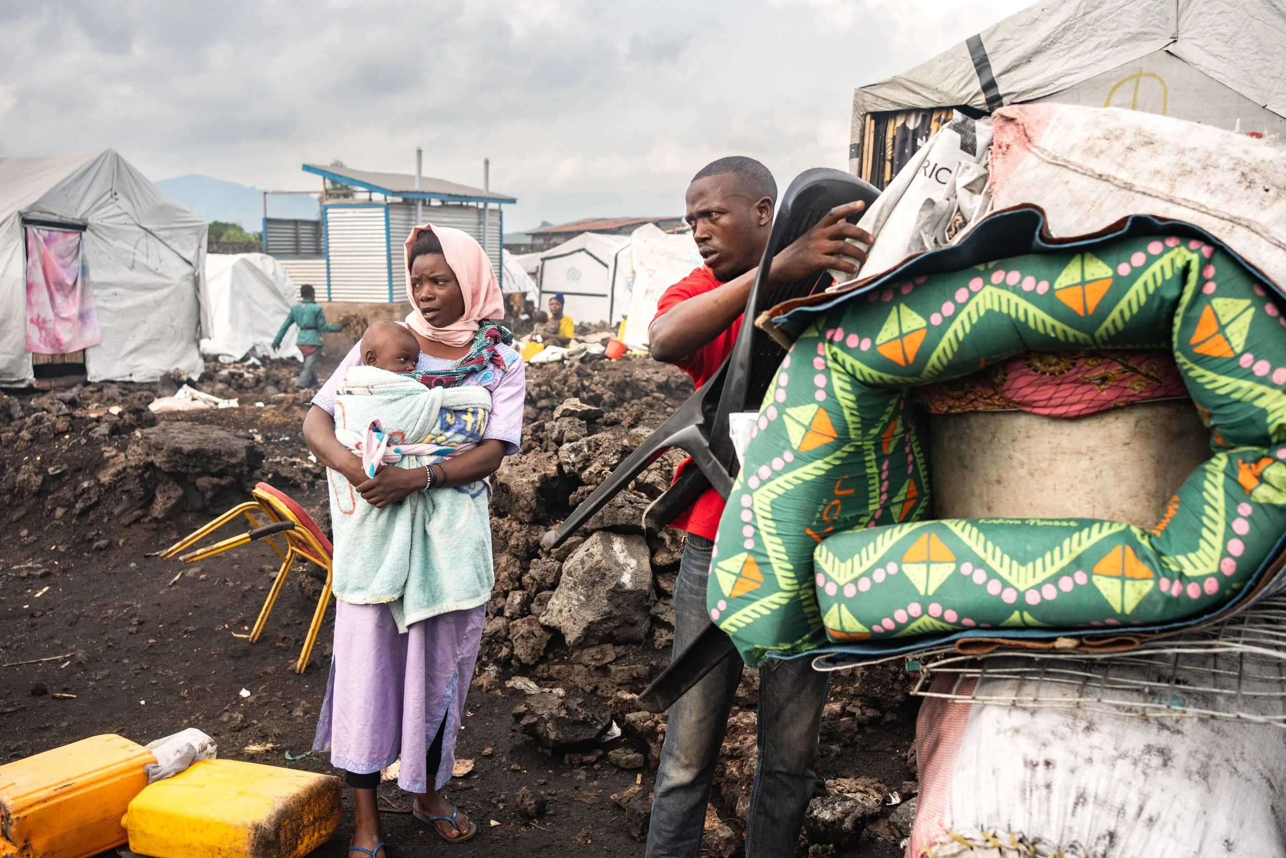 An internally displaced family packs its belongings after M23 gave 72 hours for the displaced to leave the camps, claiming that security has returned to areas under their control. February 13, 2025.