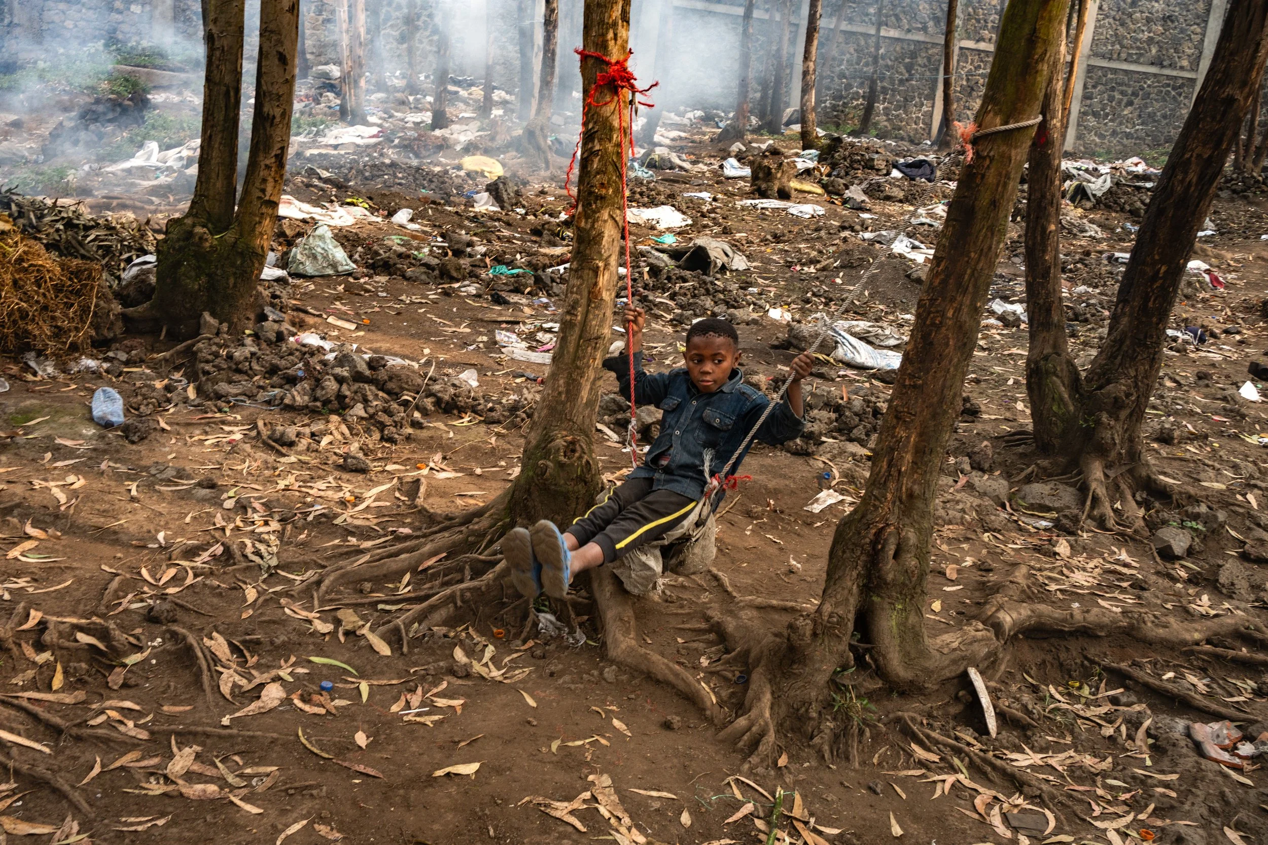 A child plays in the remains of the Kanyaruchinya displaced persons camp, which housed nearly 100,000 people and was dismantled in just a few days. Goma, February 8, 2025.