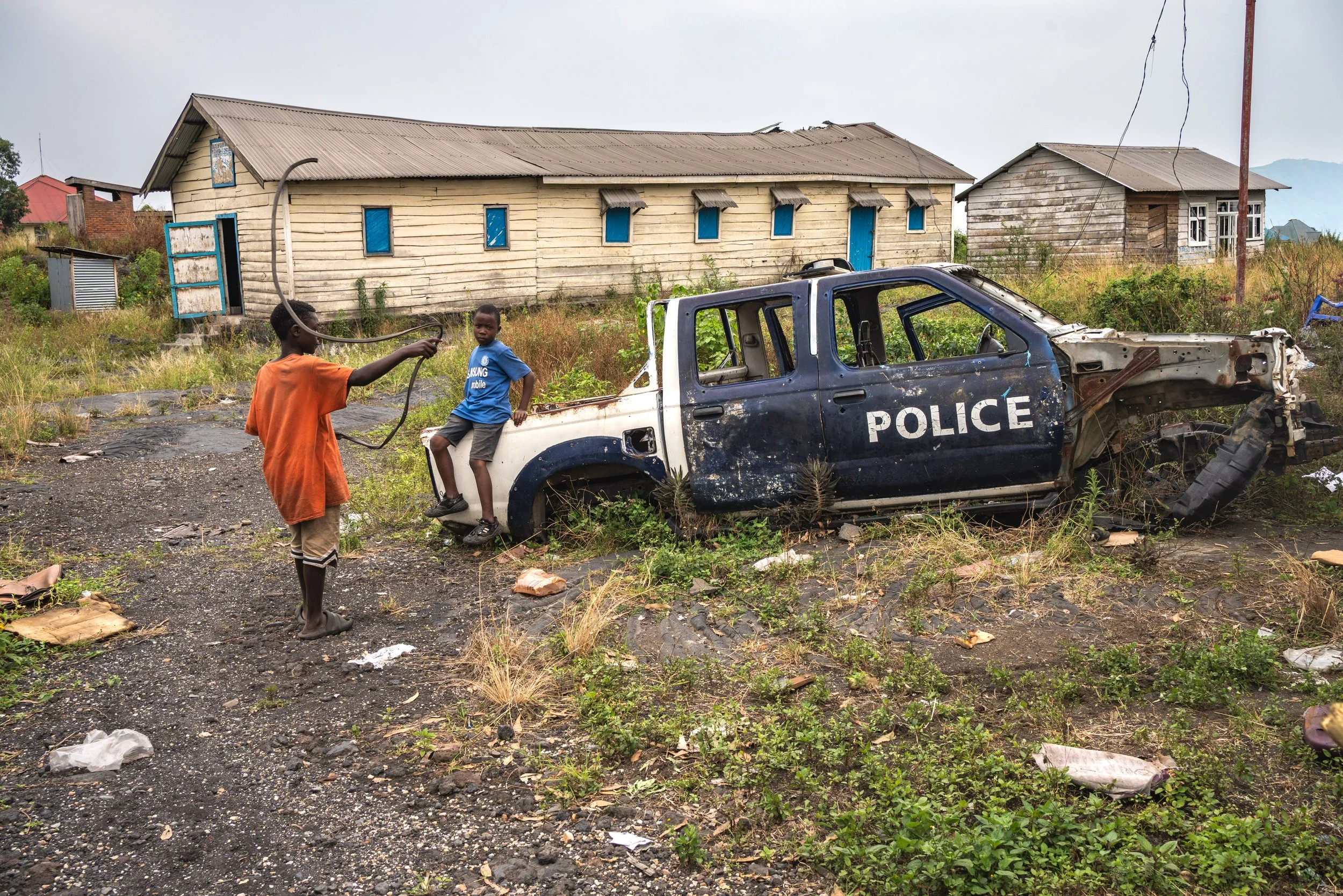 On the N2 road between Sake and Goma, children play in a police station that has been destroyed and looted.DRC, February 9, 2025.