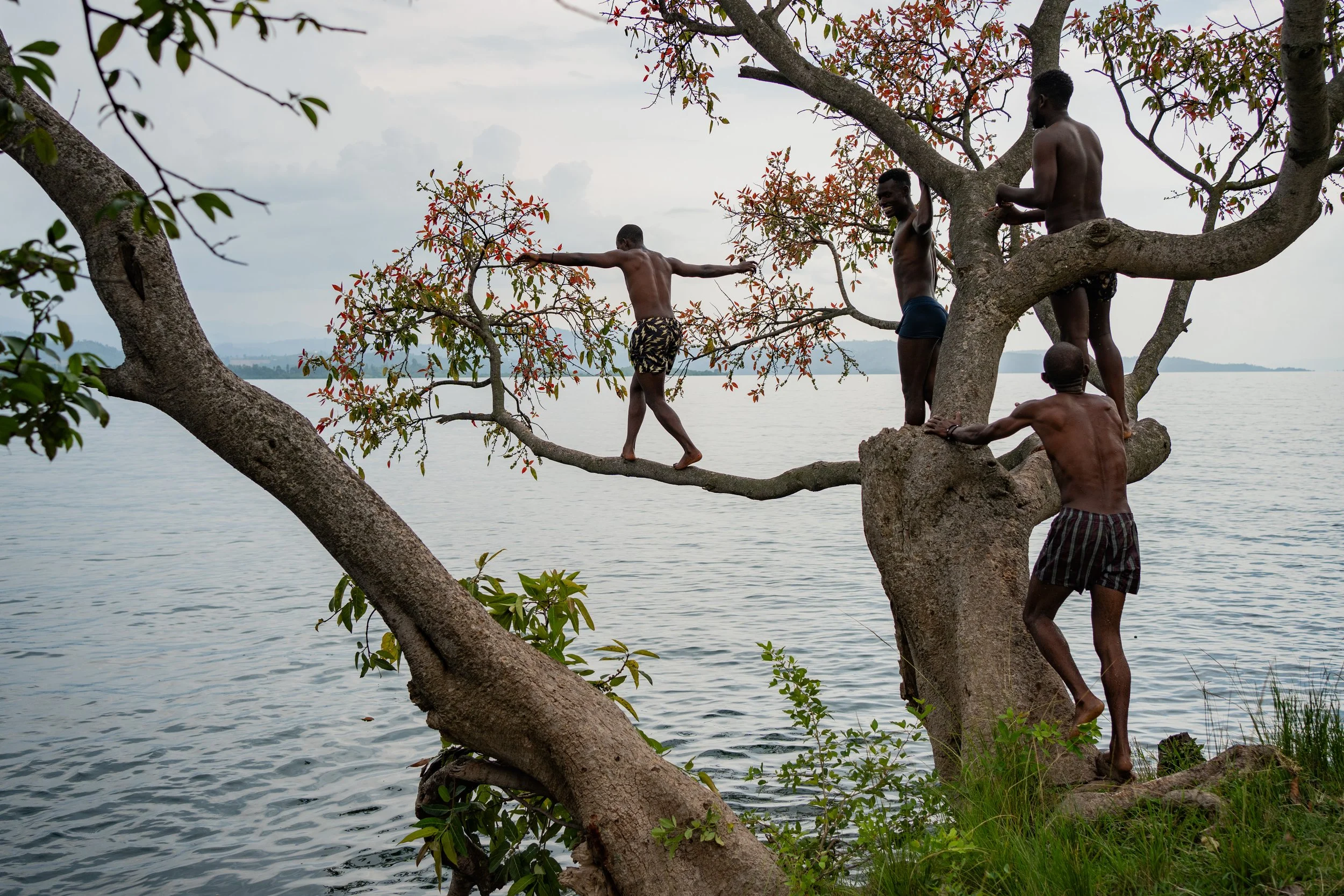 Young Rwandans dive into Lake Kivu from an island nicknamed “Peace Island.” 