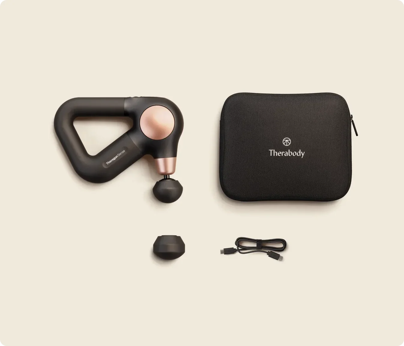 Theragun Sense massage gun with massage attachments, charging cable and travel pouch