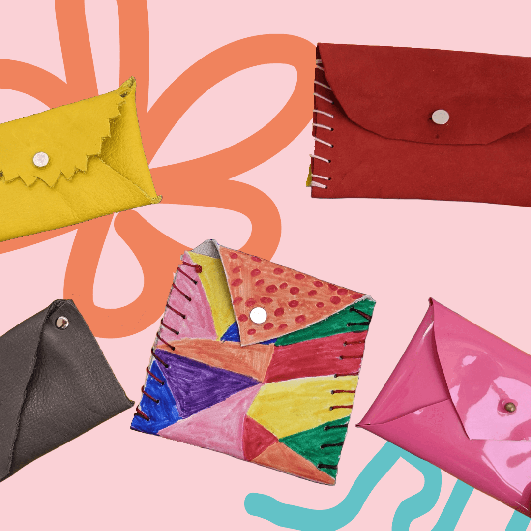 Colorful handmade leather purses on abstract background