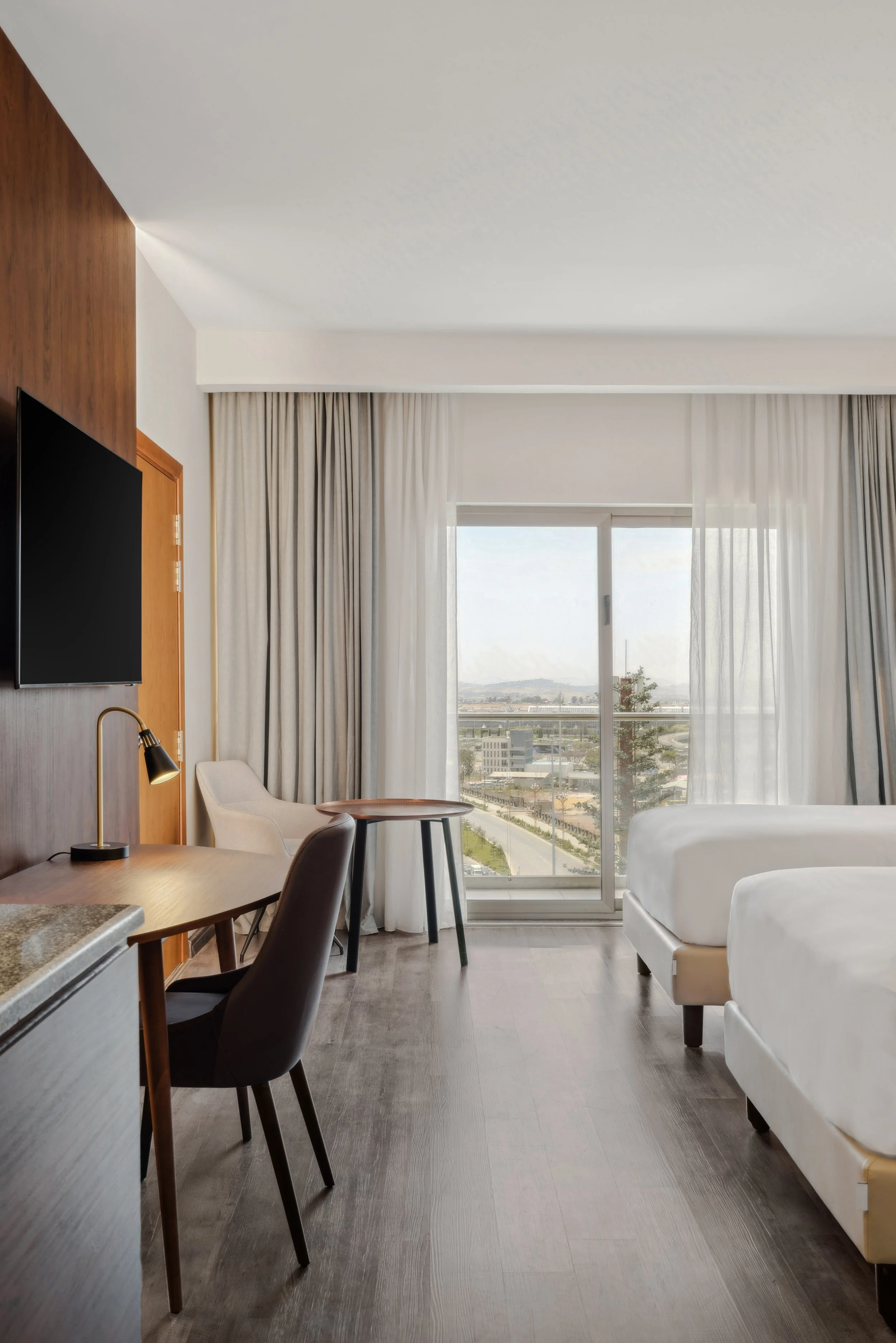 Hotel photography of hilton addis ababa airport in africa by miguel gomes professional hotel and hospitality photographer. photography featuring architecture and interior design of a luxury bedroom from the interior. Located in Ethiopia, Africa.
