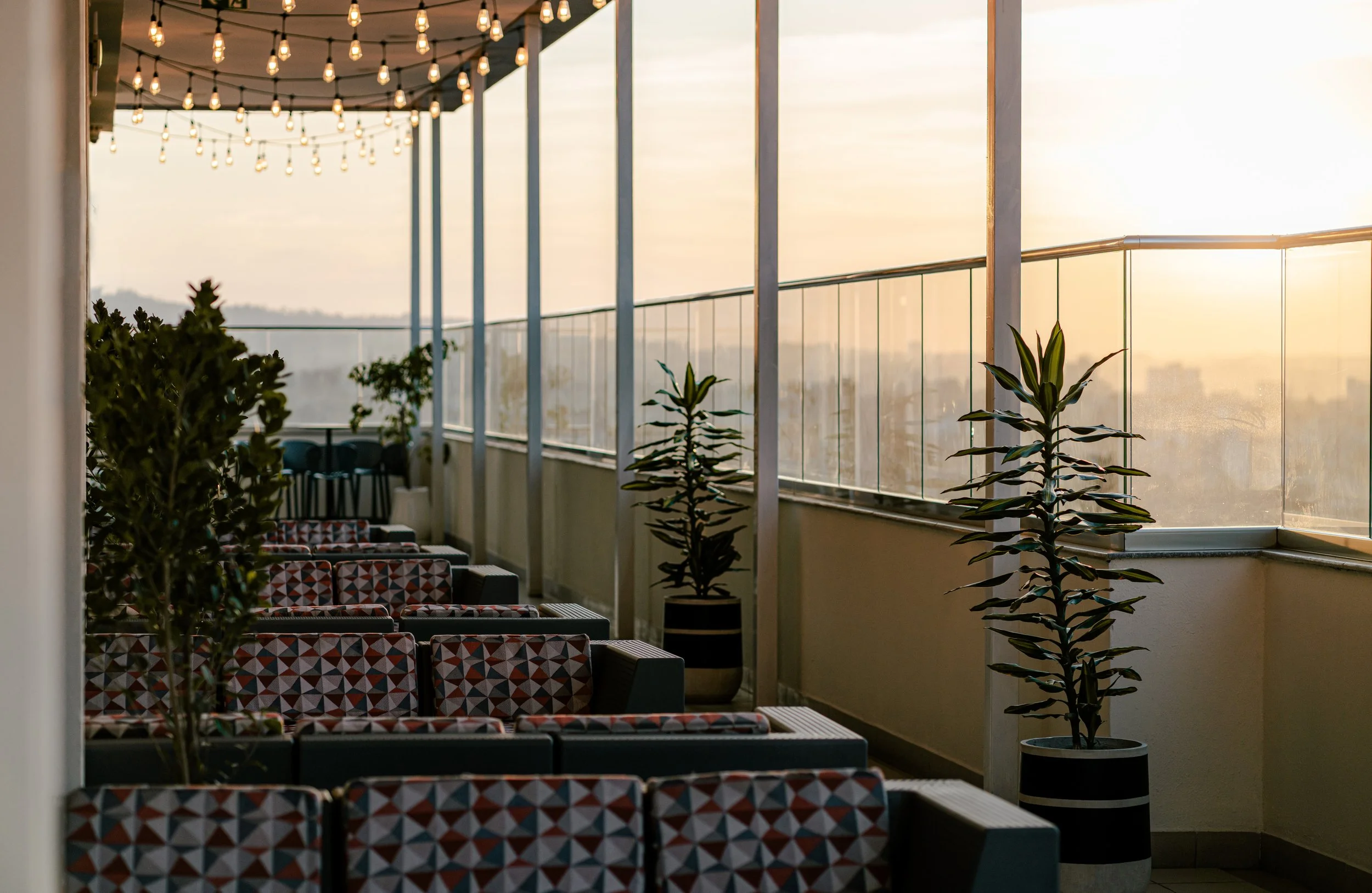 Hotel photography of hilton addis ababa airport in africa by miguel gomes professional hotel and hospitality photographer. photography featuring architecture and interior design of a balcony with view from the interior. Located in Ethiopia, Africa.