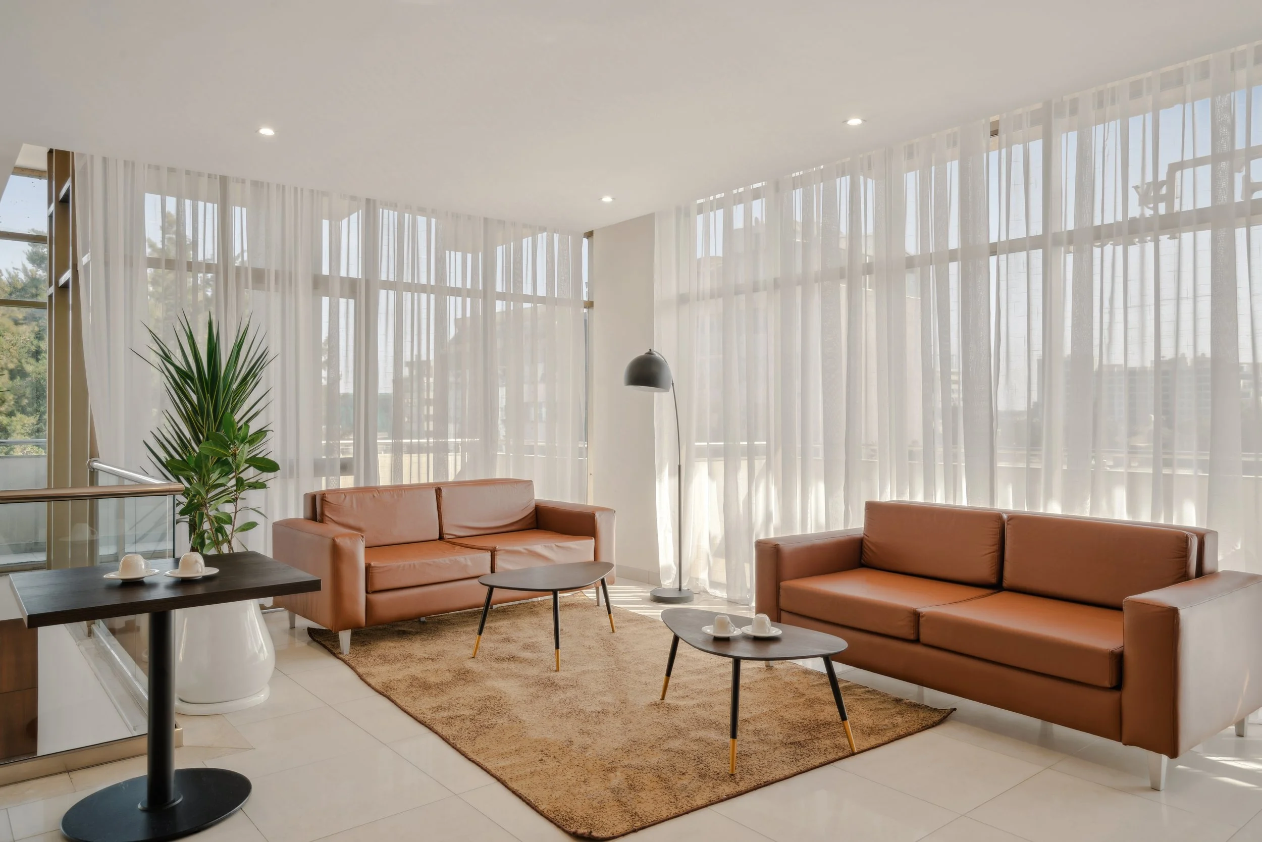 Hotel photography of hilton addis ababa airport in africa by miguel gomes professional hotel and hospitality photographer. photography featuring architecture and interior design of a meeting room break area from the interior.