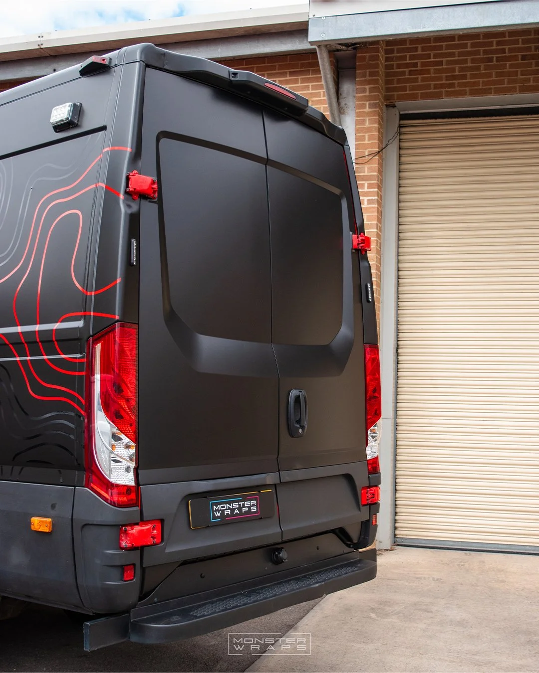 Iveco Daily 4x4 full external colour change vinyl wrap Oracal Matte Black with topographic graphics