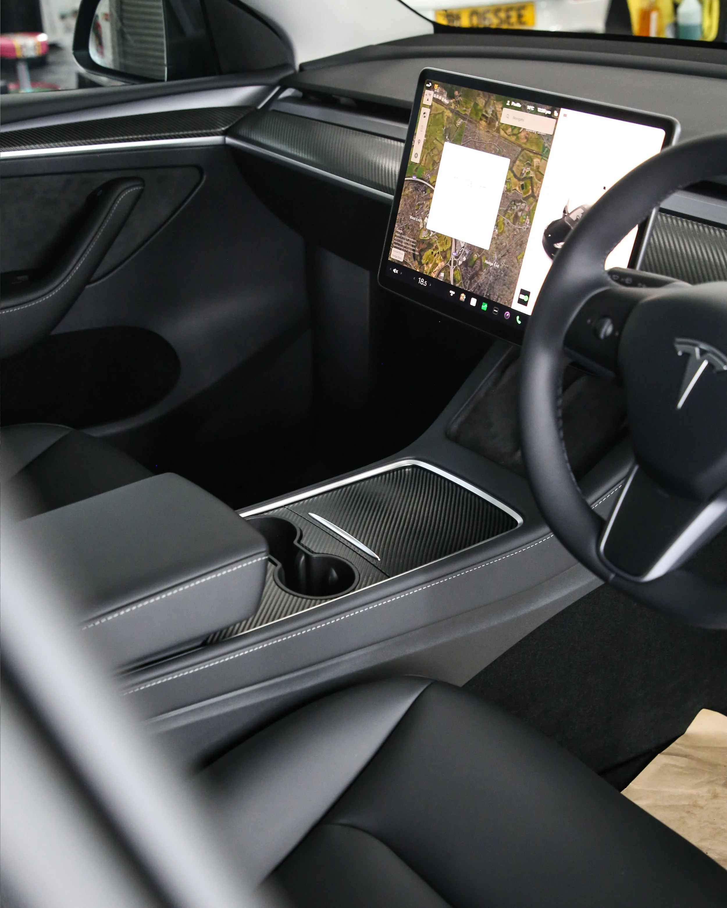 tesla model 3, tesla model S, tesla model Y interior wrapped in 3M black textured carbon fibre wrapping vinyl