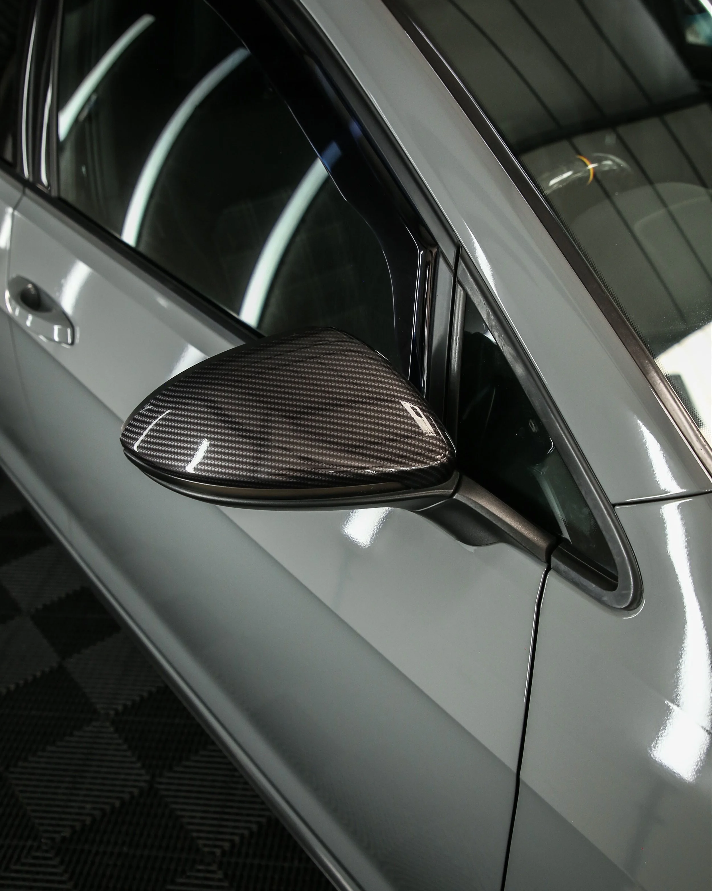 Volkswagen golf mk7 wing mirrors wrapped in 3M high gloss carbon fibre wrapping vinyl