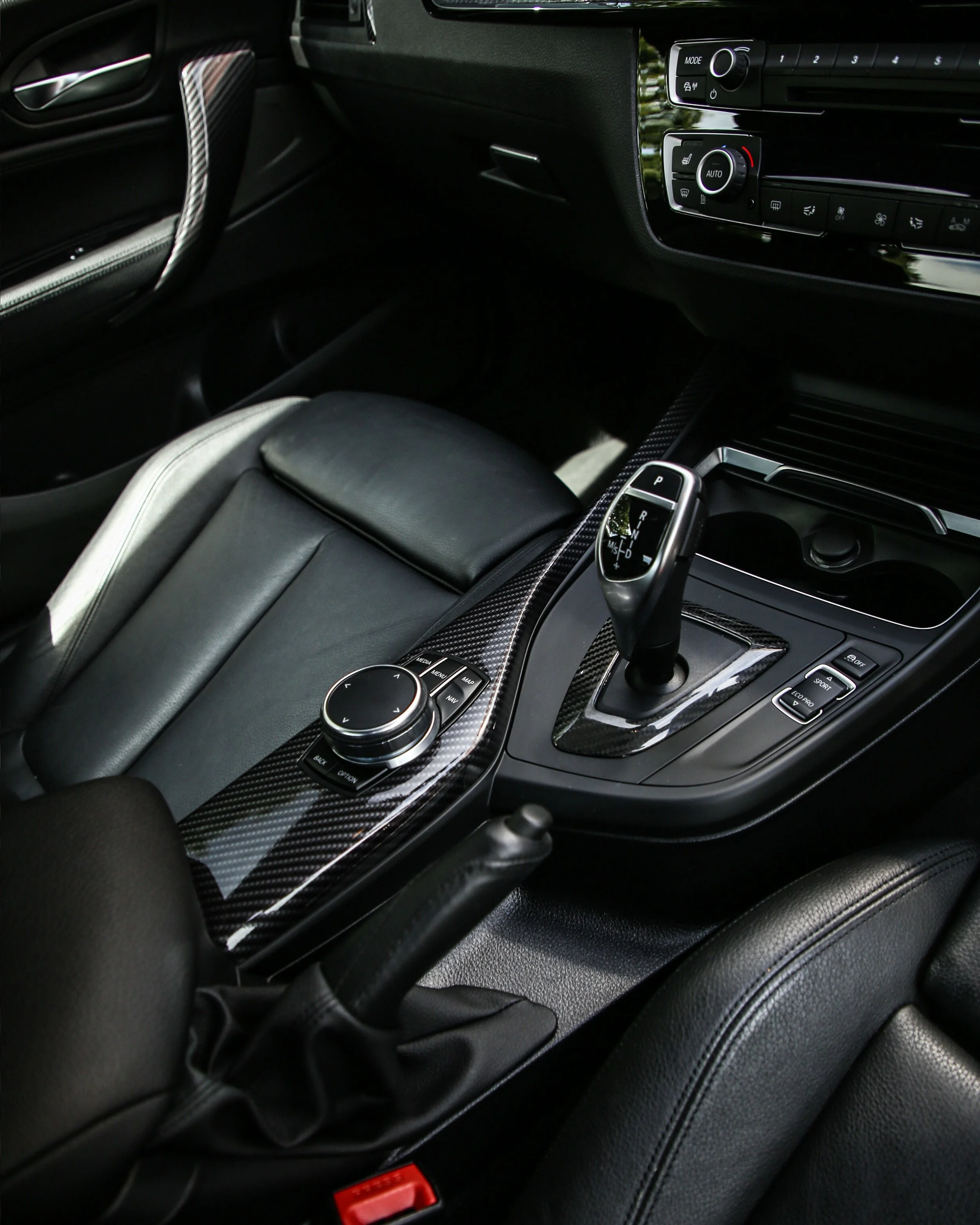 BMW 2 series M240i interior trims wrapped in 3M high gloss carbon fibre wrapping vinyl